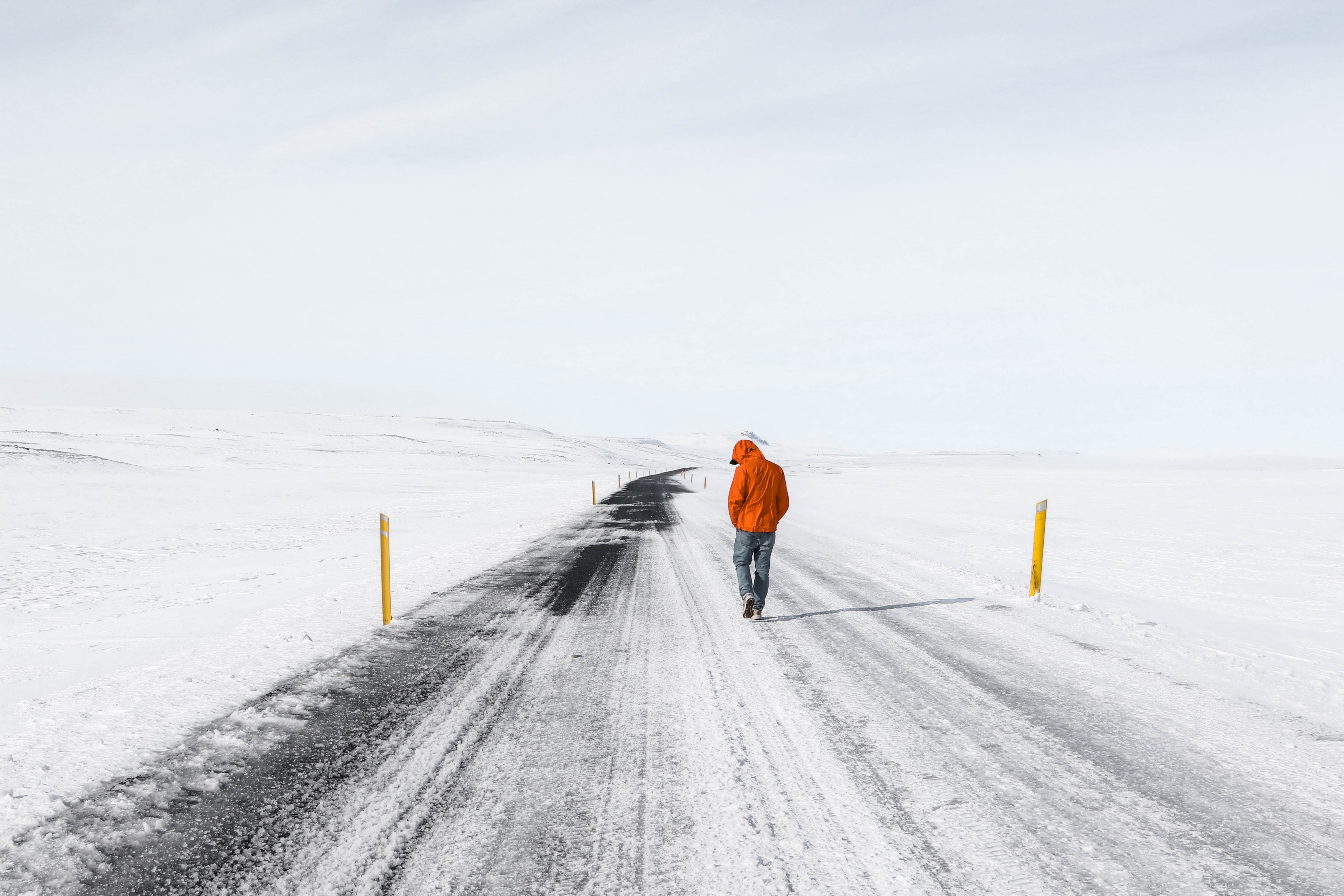 a lone man walking on a snowy road surrounded by snow covered fields, silence on a snowy road 4k, HD Wallpaper