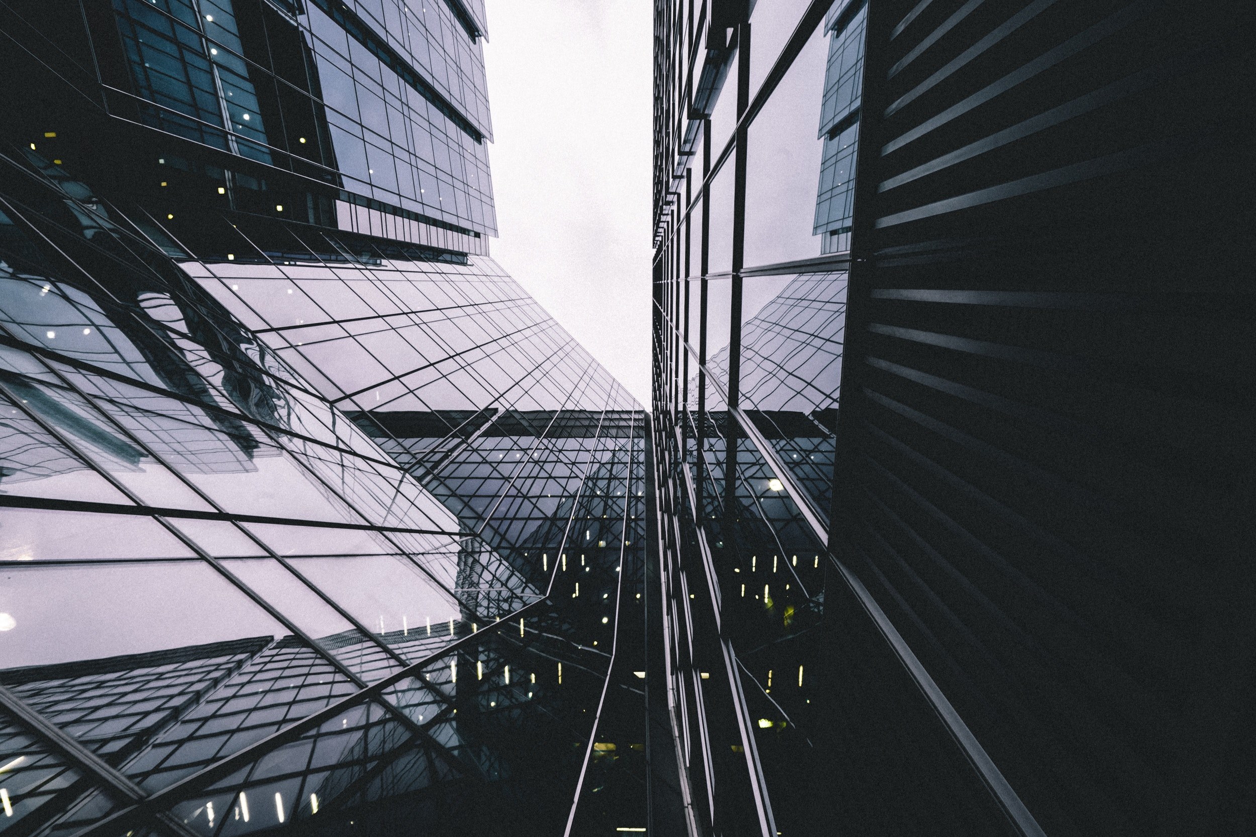 a low angle shot of a reflective office building facade in canary wharf, facade mirror 4k, HD Wallpaper