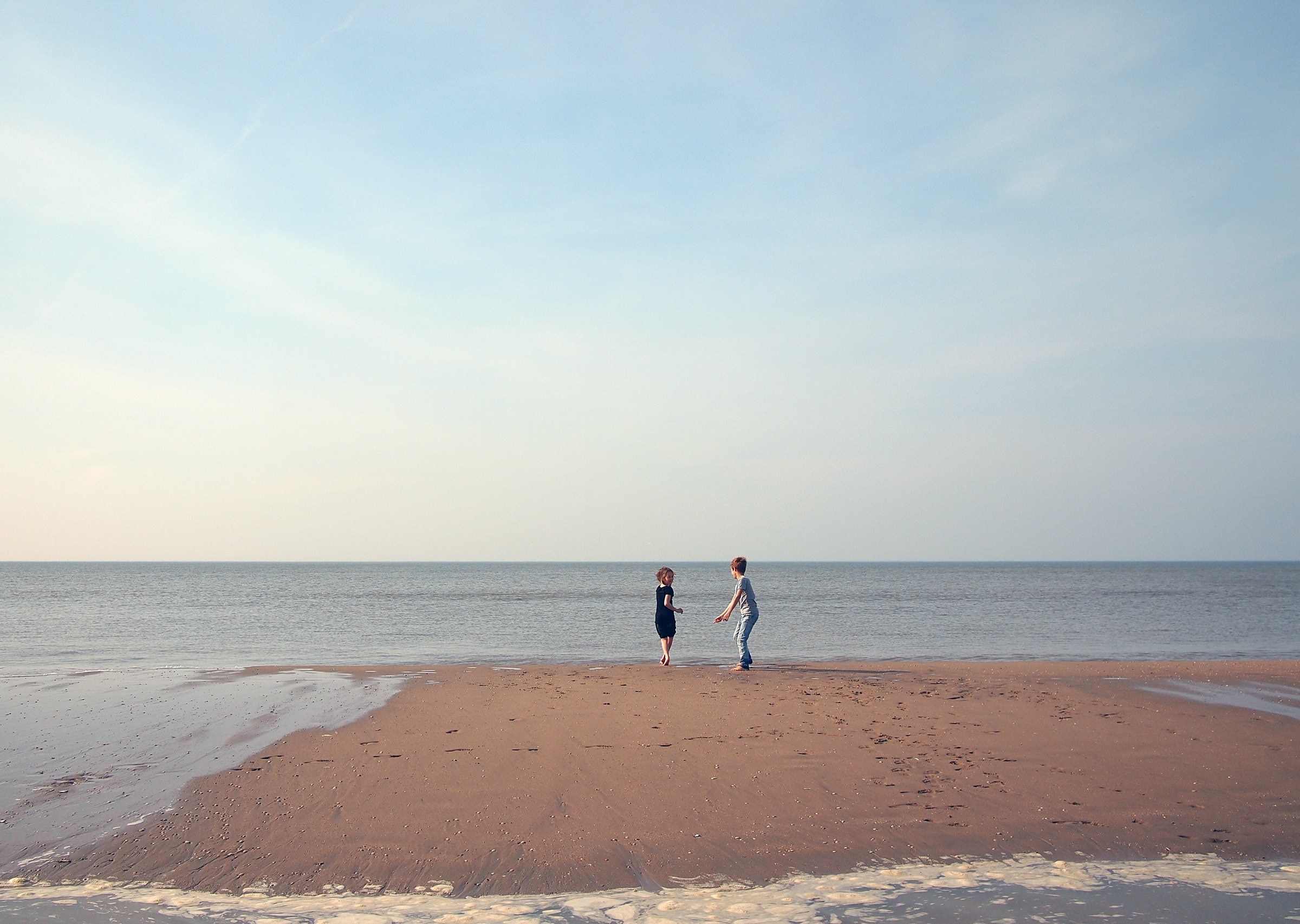 two beautiful kids enjoy play time on the beach shore, children enjoying the beach 4k, HD Wallpaper