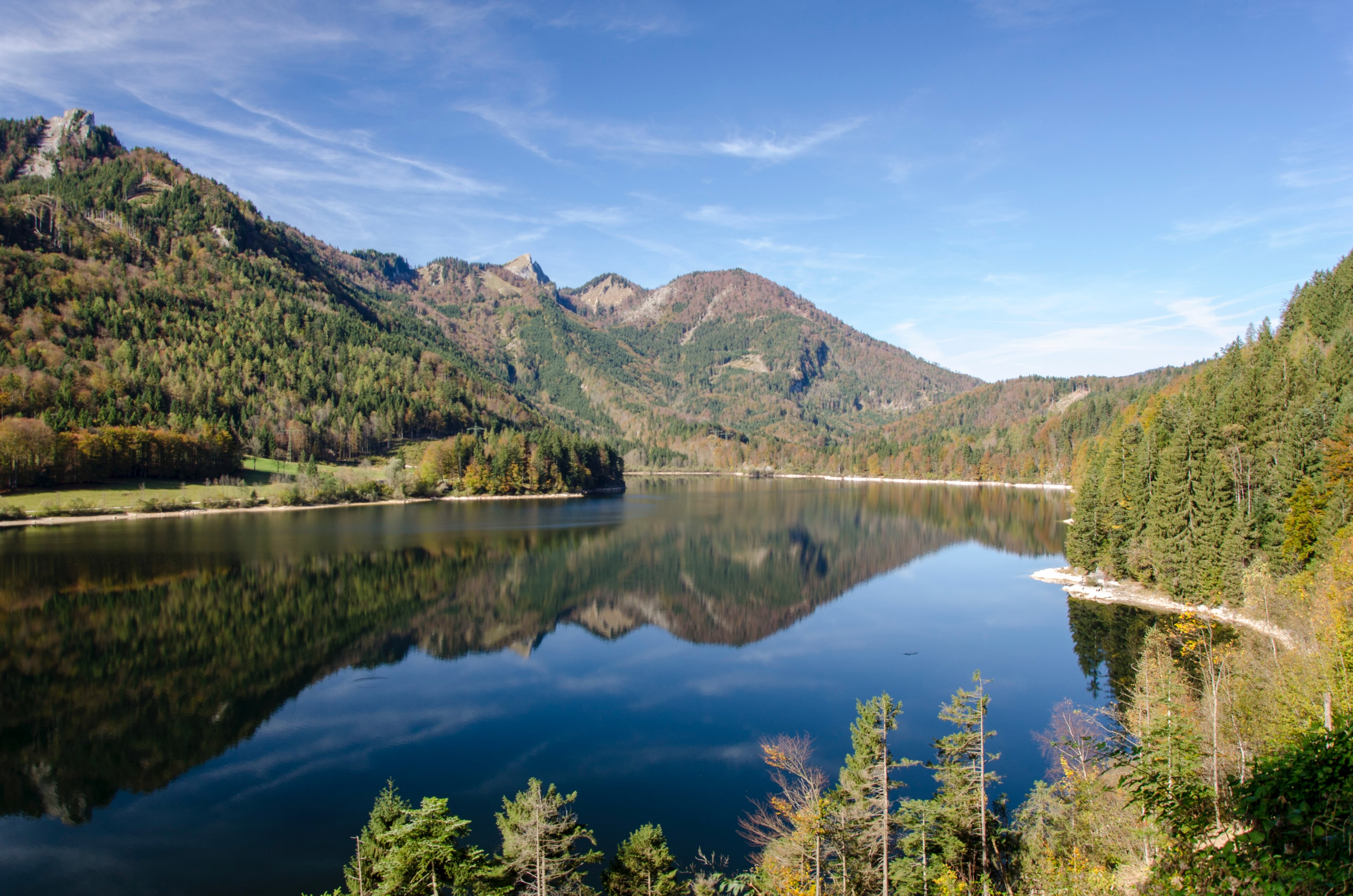 a smooth lake in austria reflecting the nearby mountains, austrian mountains over a lake 4k, HD Wallpaper