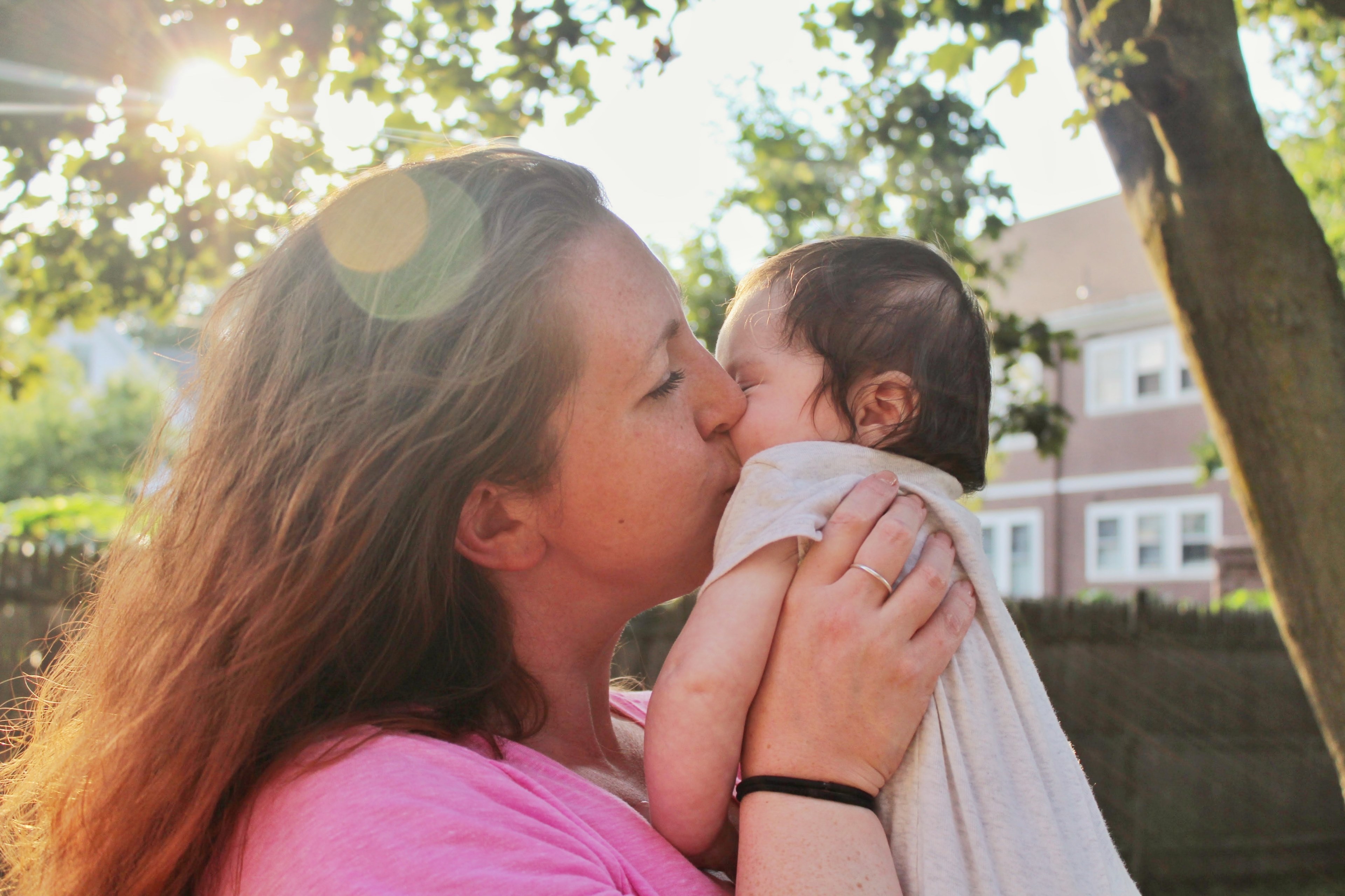 a woman kissing an infant on the cheek, _kissing her baby 4k, HD Wallpaper