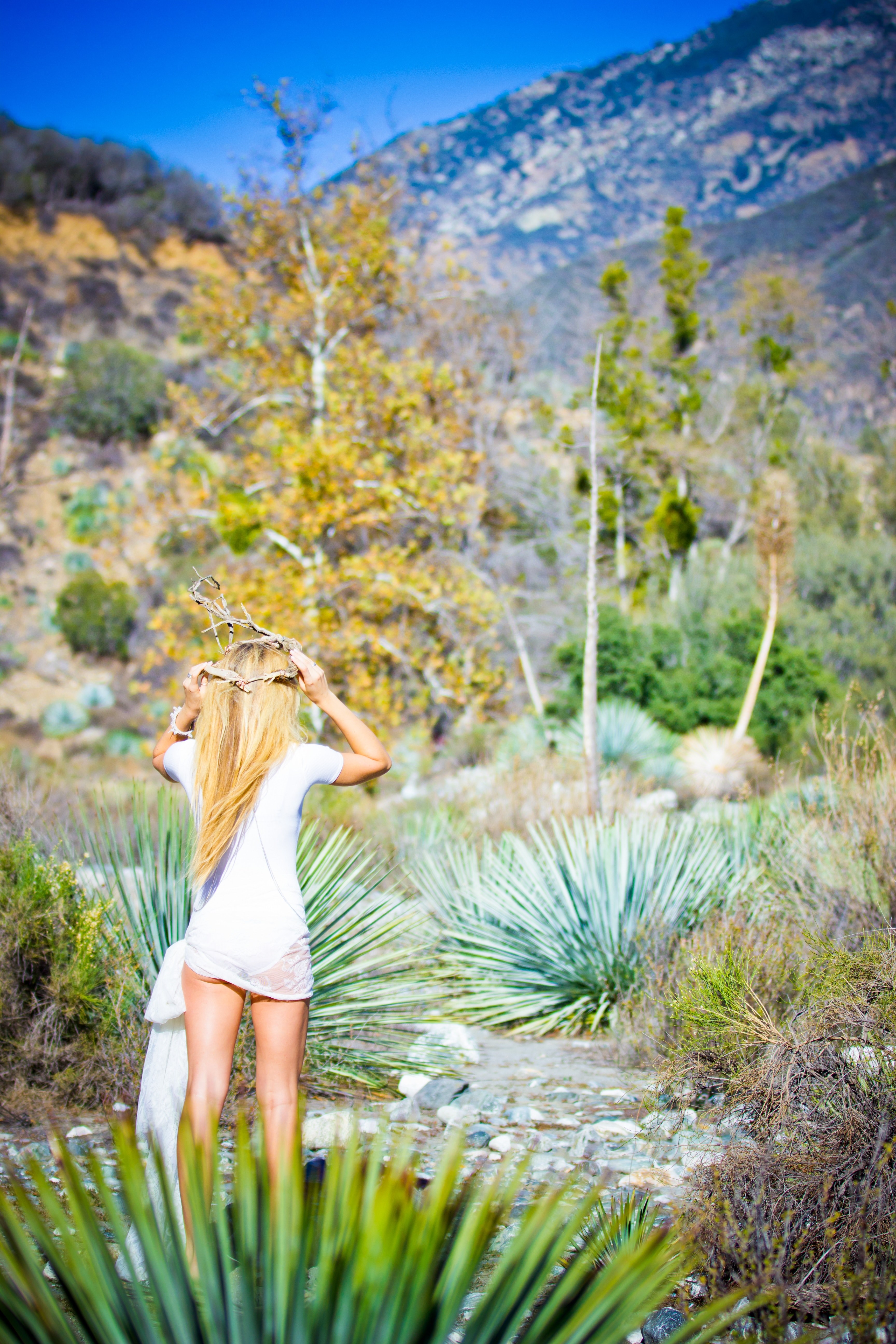 bohemian dressed woman walks in the desert of bridge to nowhere trailhead, desert flower crown 4k, Phone HD Wallpaper