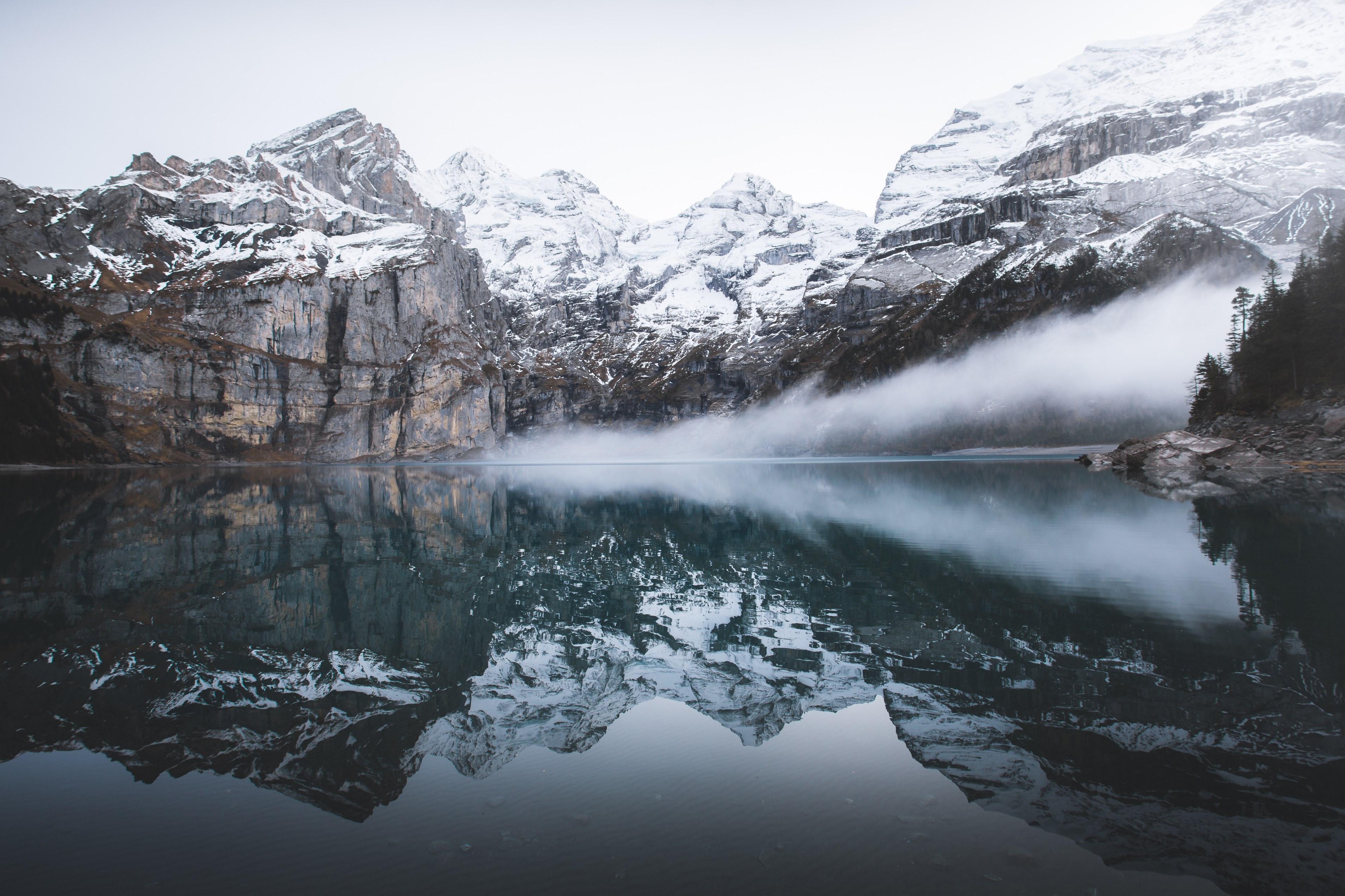 snowcapped mountains being reflected in the crystal clear oeschinen lake, the fog was rolling in 4k, HD Wallpaper