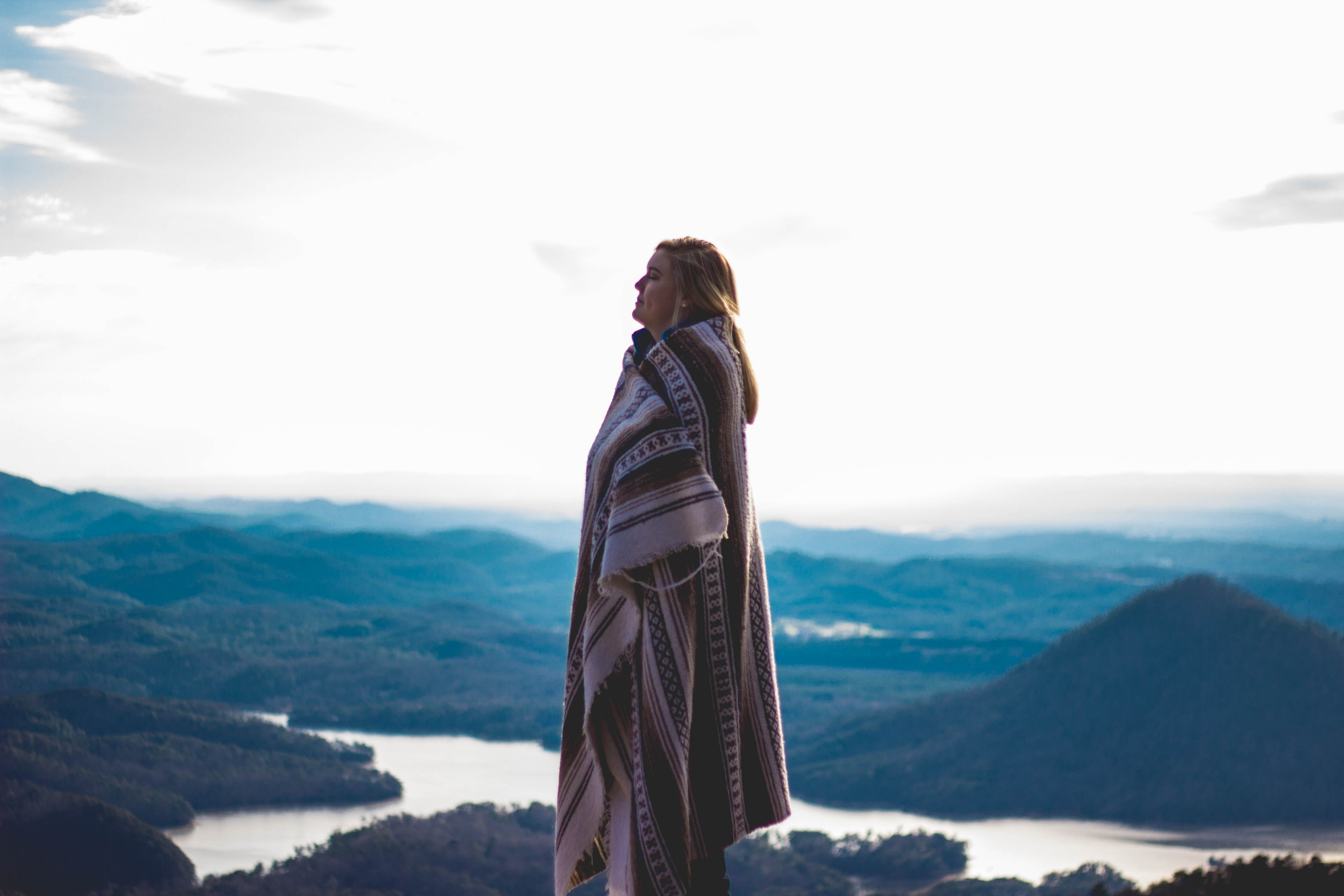 person wrapped up in an oversized blanket shawl near the mountains, blanket scarf 4k, HD Wallpaper