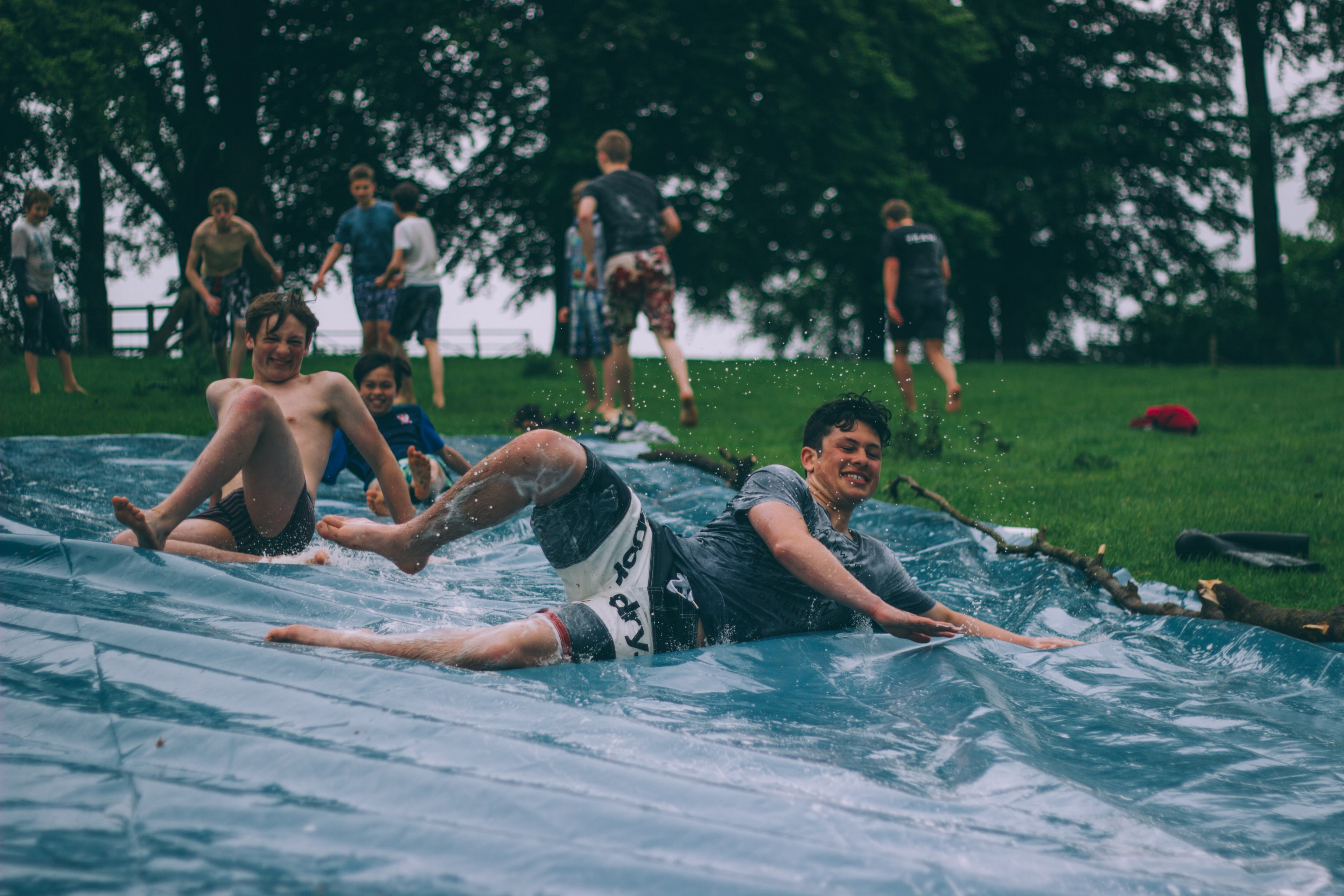 boys with happy faces enjoying slip and slide in wydale hall amp emmaus centre, wydale hall amp emmaus centre 4k, HD Wallpaper