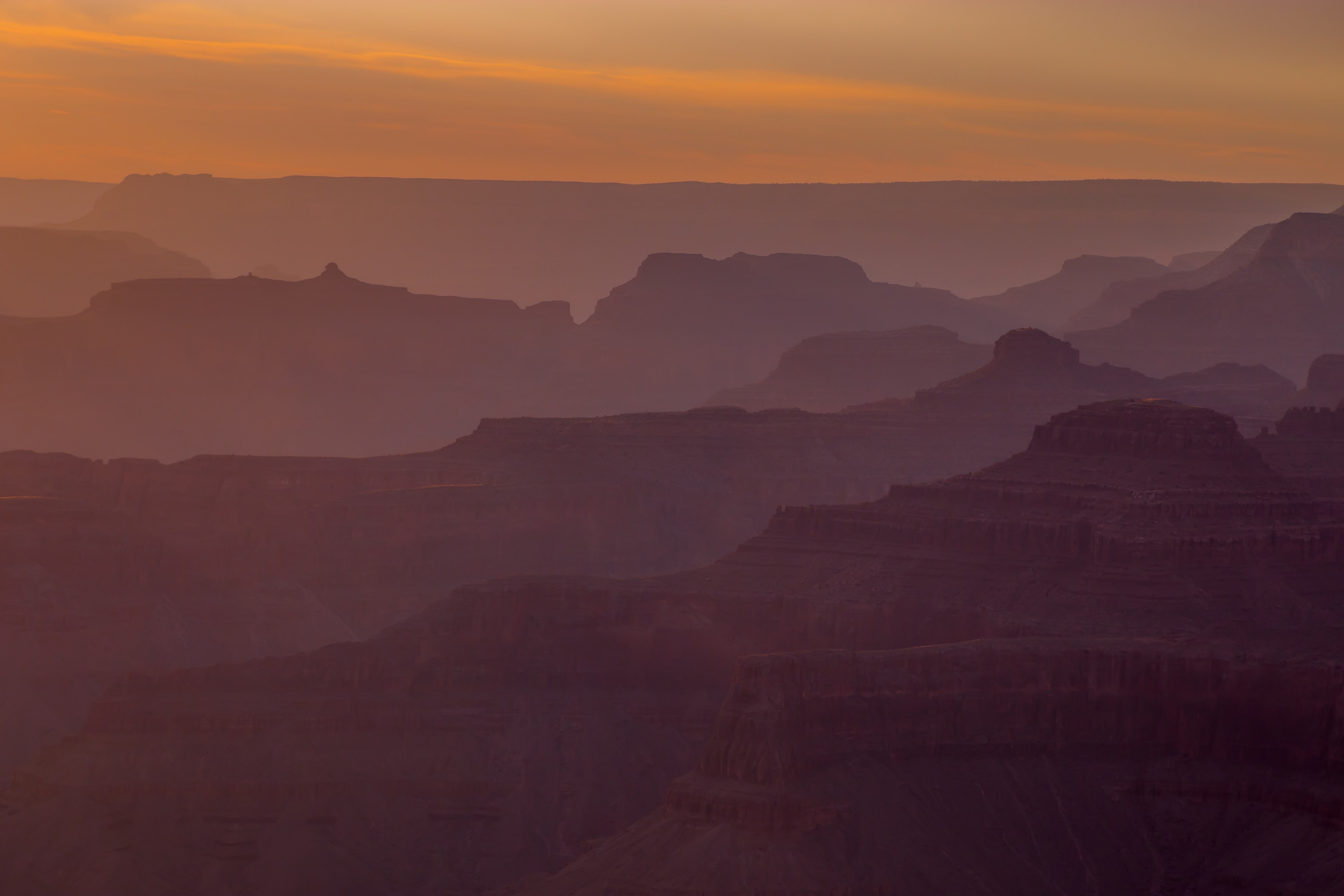 hazy view of rock formations at arizonas grand canyon national park at dusk, mountain range rocks sunset and dusk 4k, HD Wallpaper