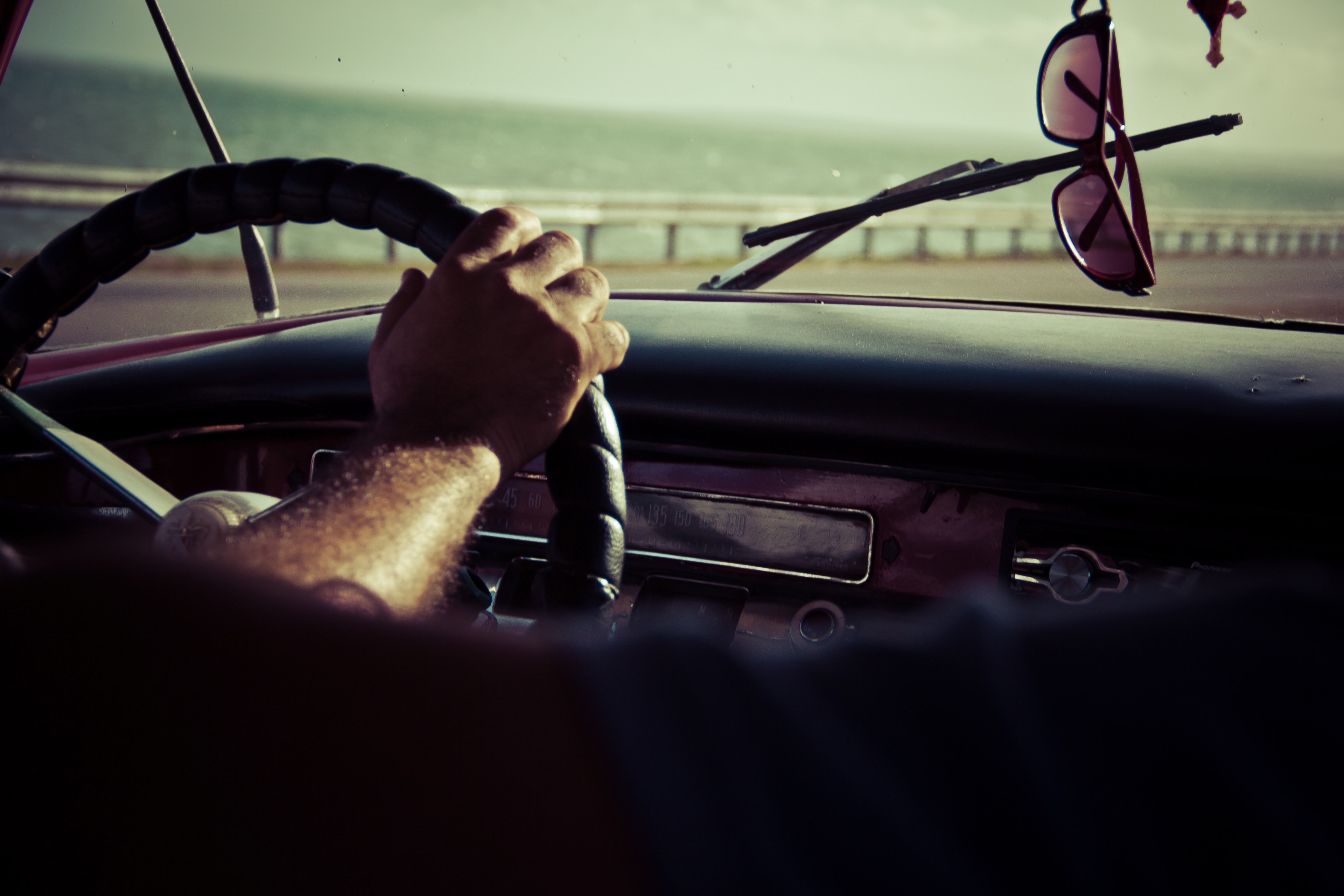 interior back seat shot of man driving car on sunny day at coast, man driving car near coast 4k, HD Wallpaper