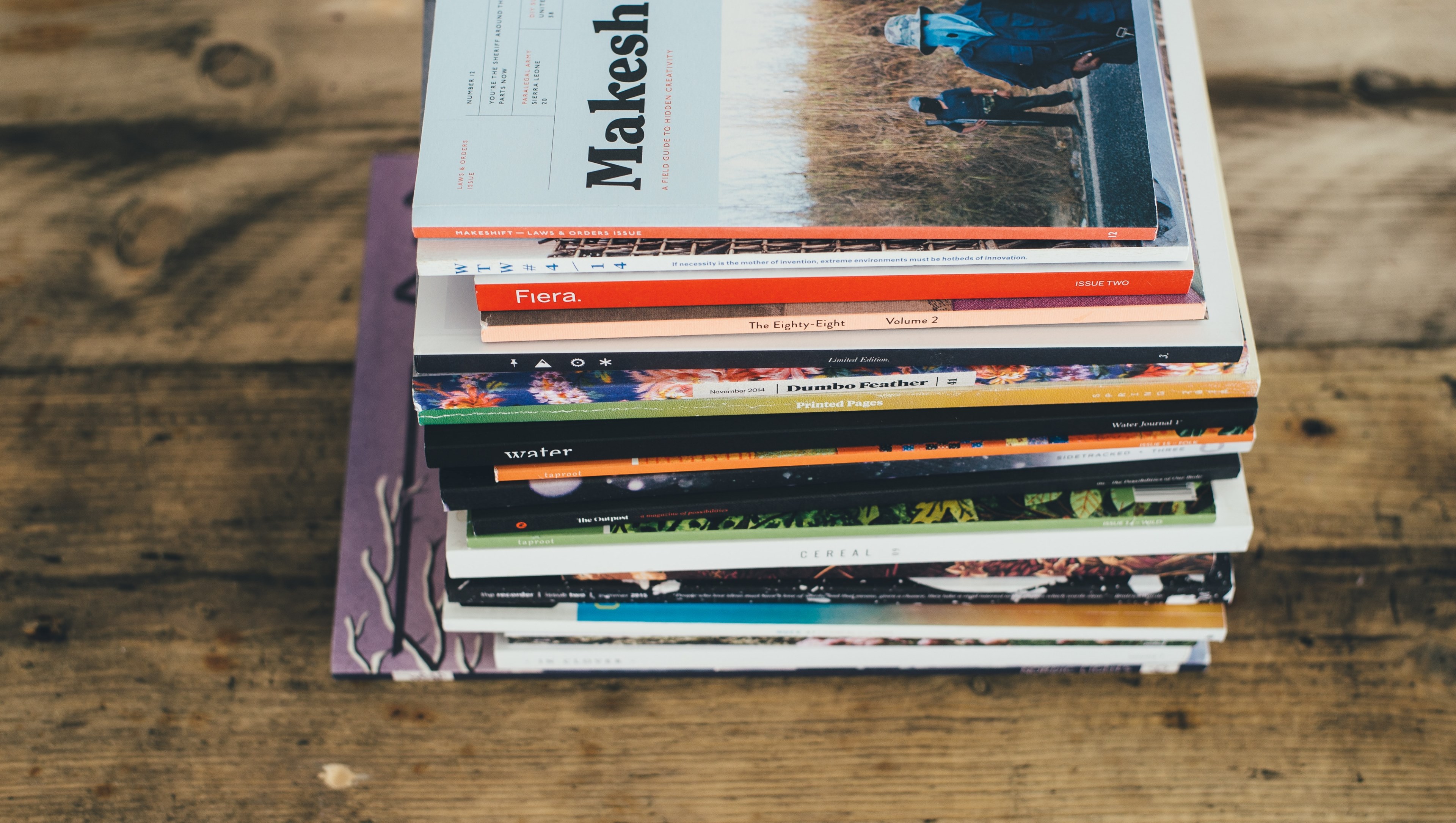 a stack of colorful books on a wooden surface, colorful book stack 4k, HD Wallpaper