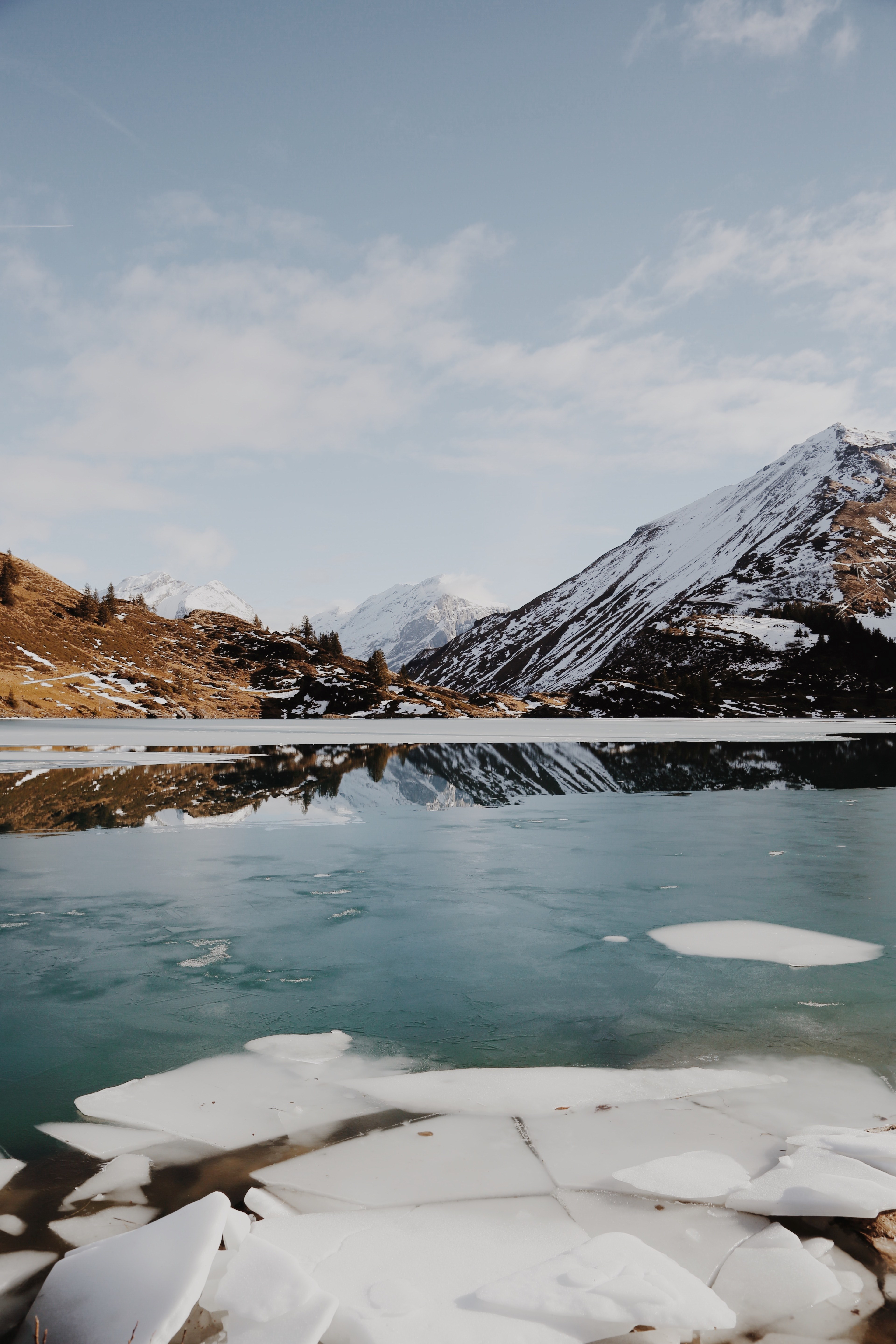 the reflection of snowy mountain peaks in a frozen lake in trbsee, trbsee lake reflections 4k, Phone HD Wallpaper