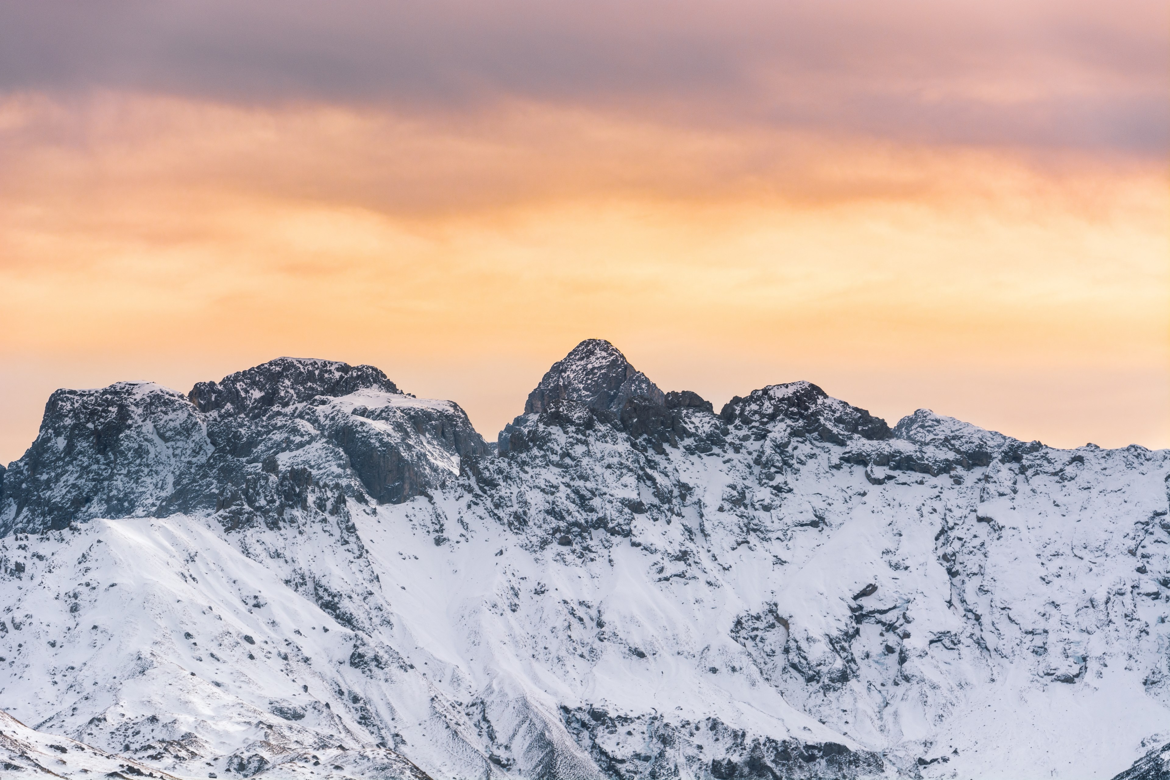 a snowy mountain ridge under an orange sky near seiser alm, orange sky over the mountains 4k, HD Wallpaper