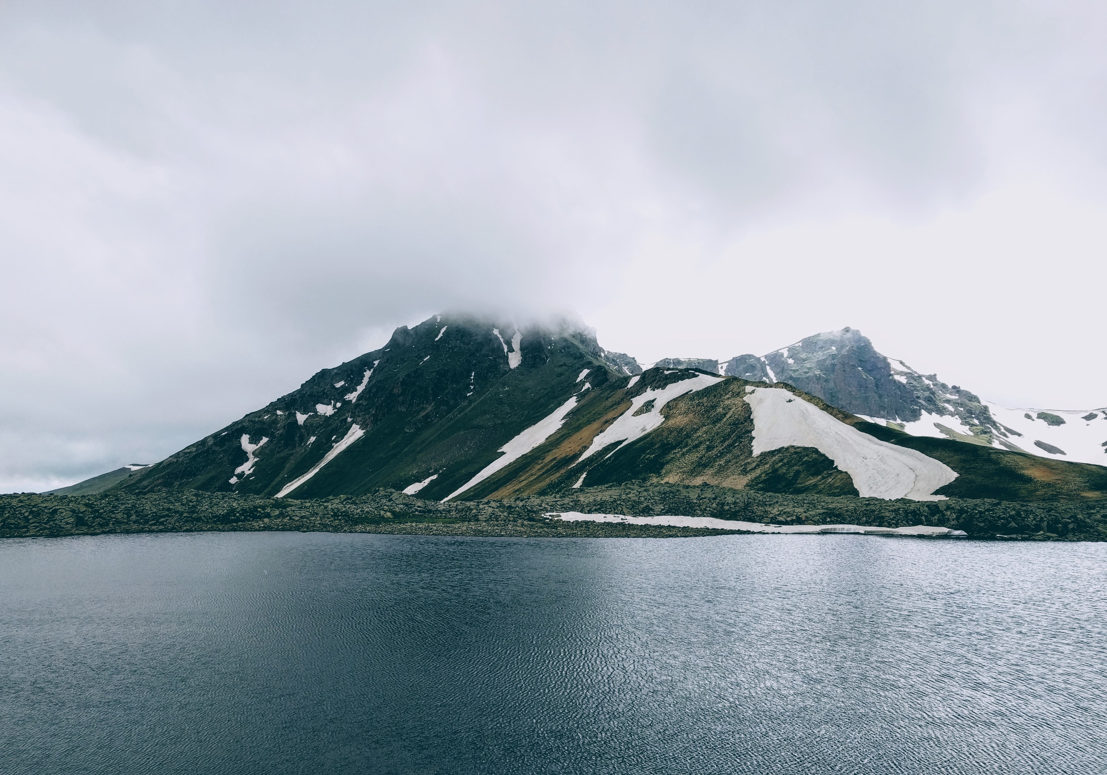 lush island with large snowy mountains near a calm lake, mountains near ughtasar lake 4k, HD Wallpaper
