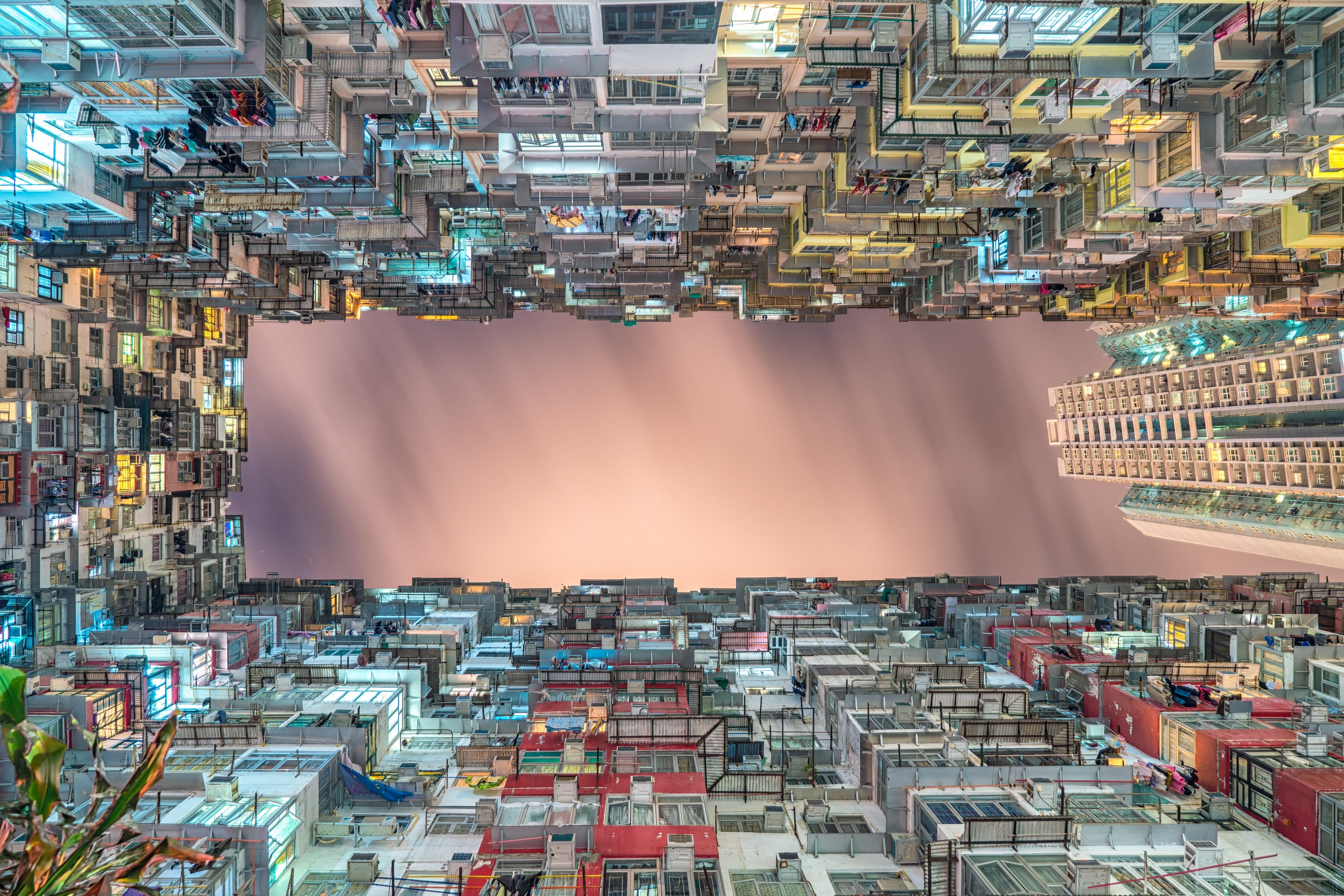 view from the bottom of a cramped residential building courtyard at night, cramped housing 4k, HD Wallpaper