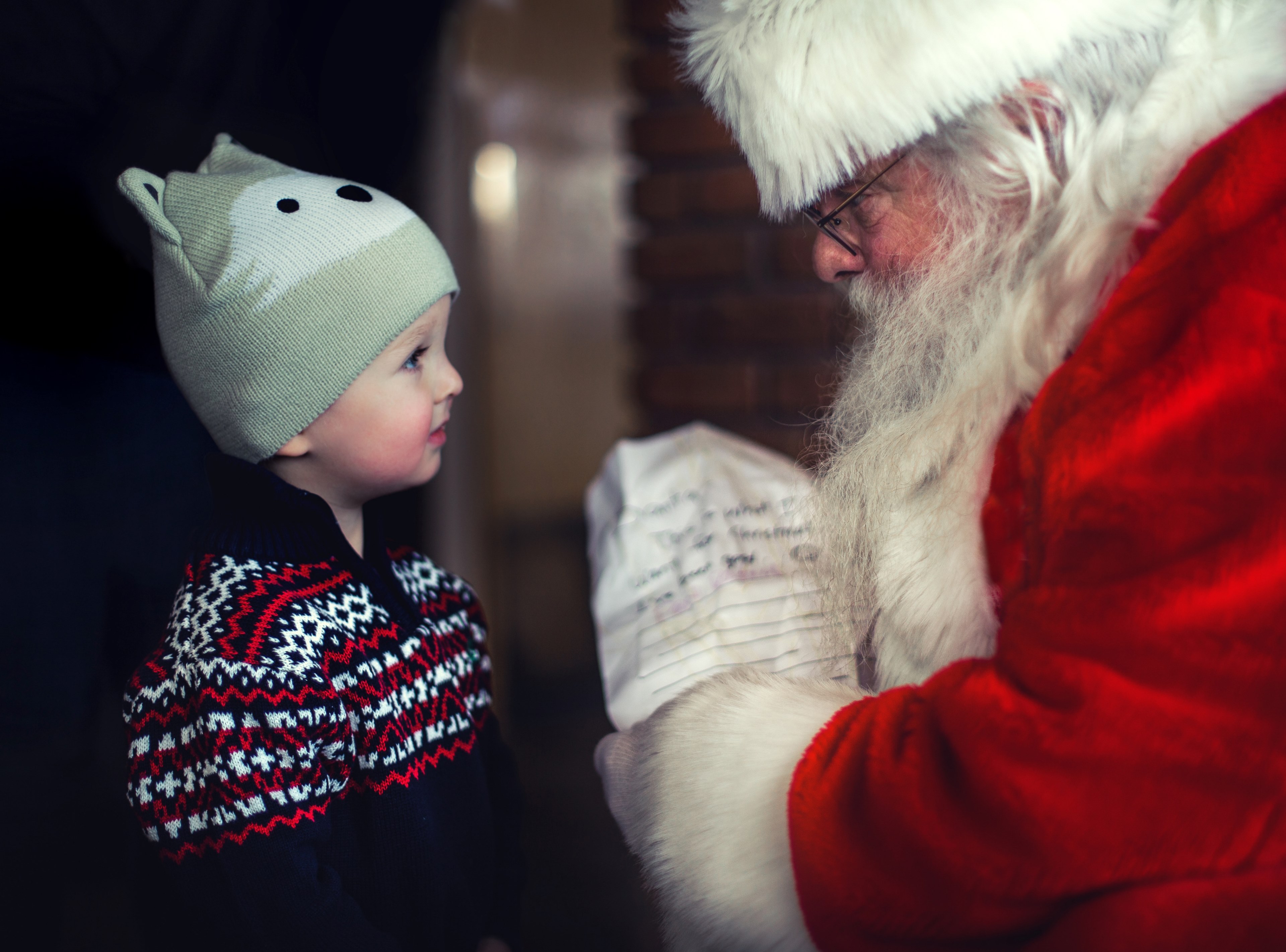 a young boy wearing a festive hat being given a gift by father christmas in stillwater, christmas list for santa 4k, HD Wallpaper