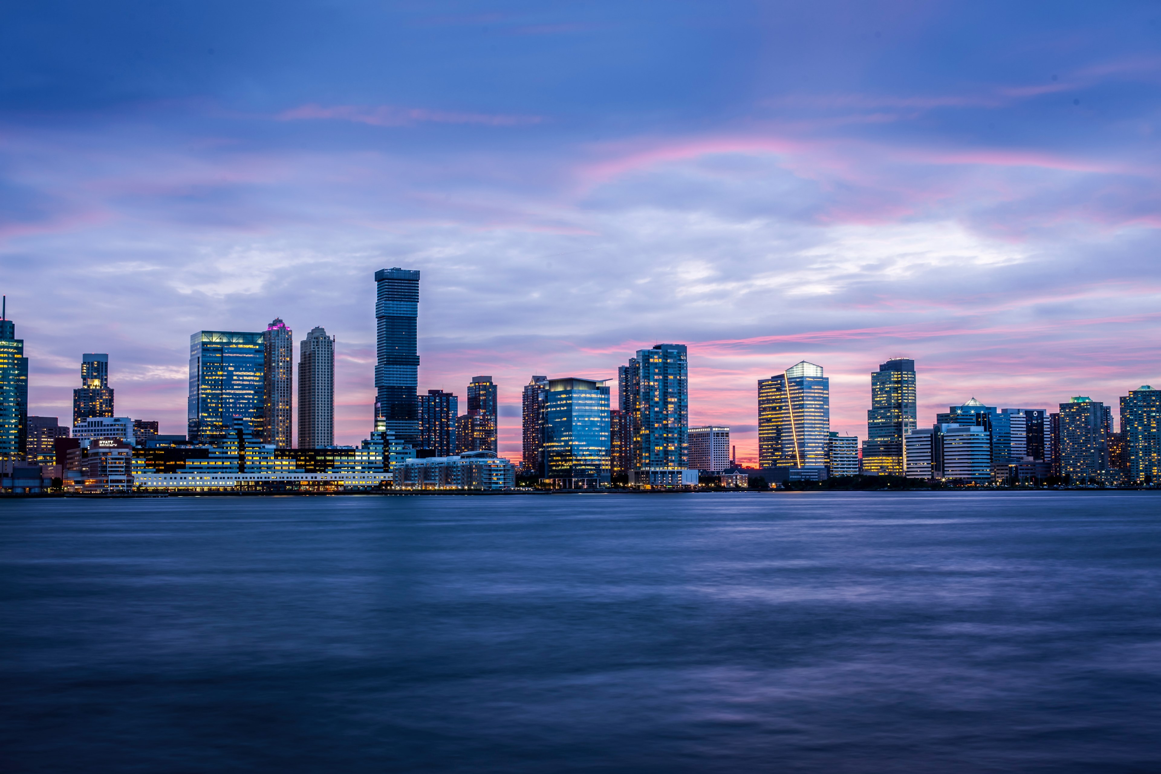 the bright skyline of new york seen from the hudson river at night, across the way 4k, HD Wallpaper