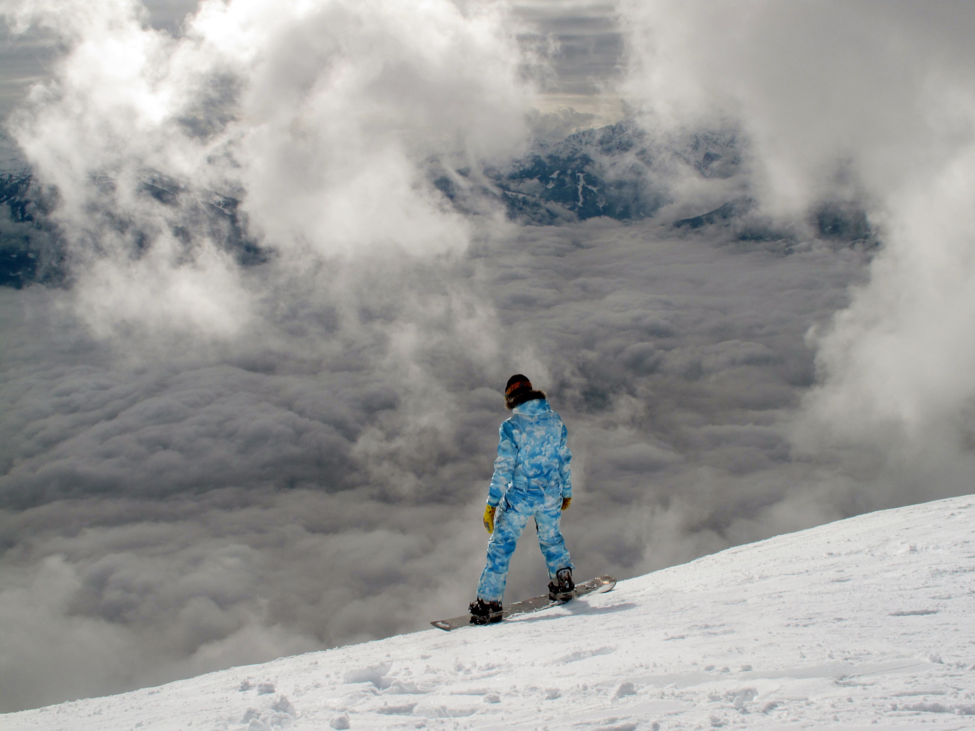 a snowboarder overlooking a cloudy and snow covered hill, snowboarder on a cloudy hill 4k, HD Wallpaper