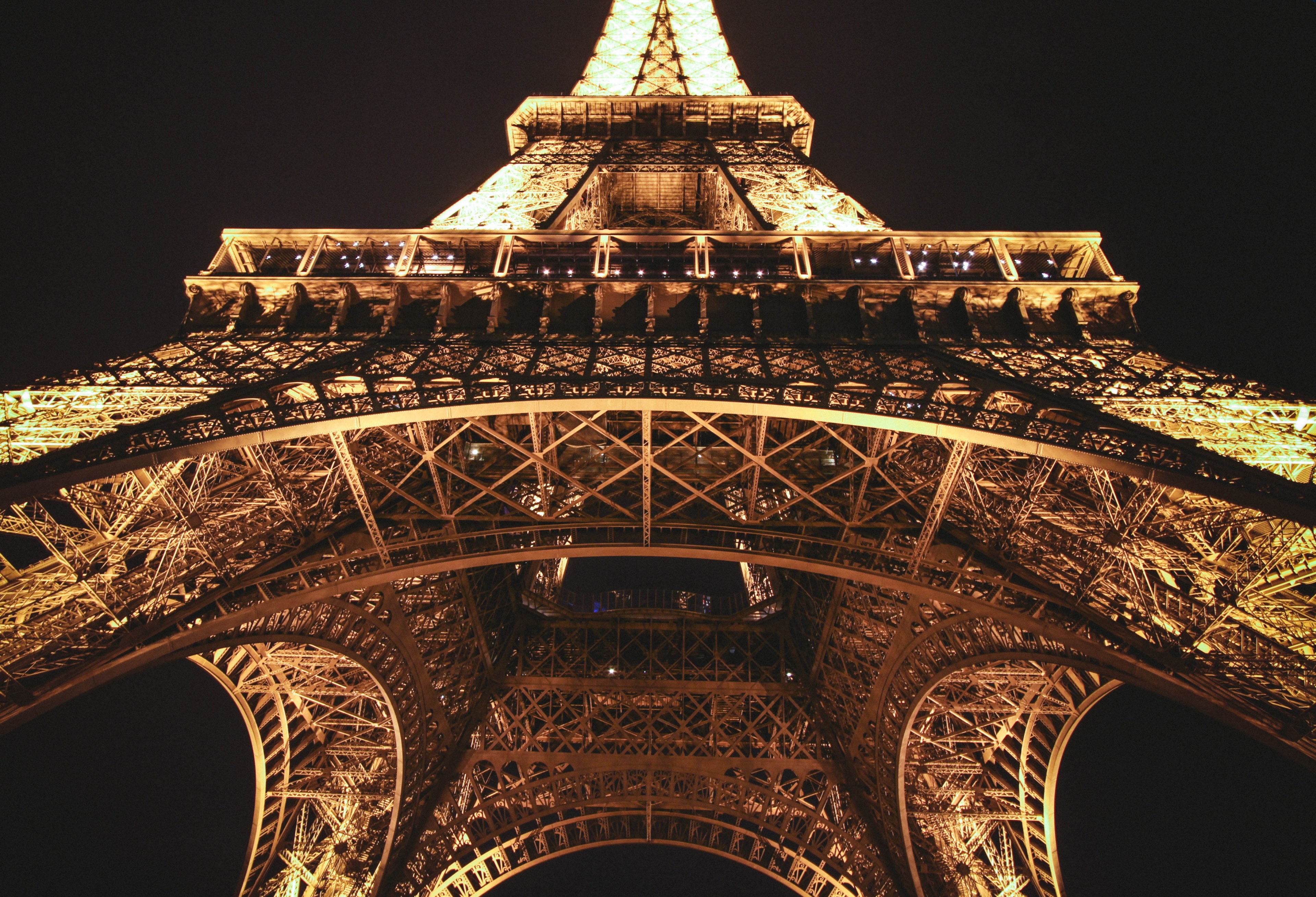 a centered shot looking up at the eiffel tower in paris illuminated at night, eiffel tower at night 4k, HD Wallpaper