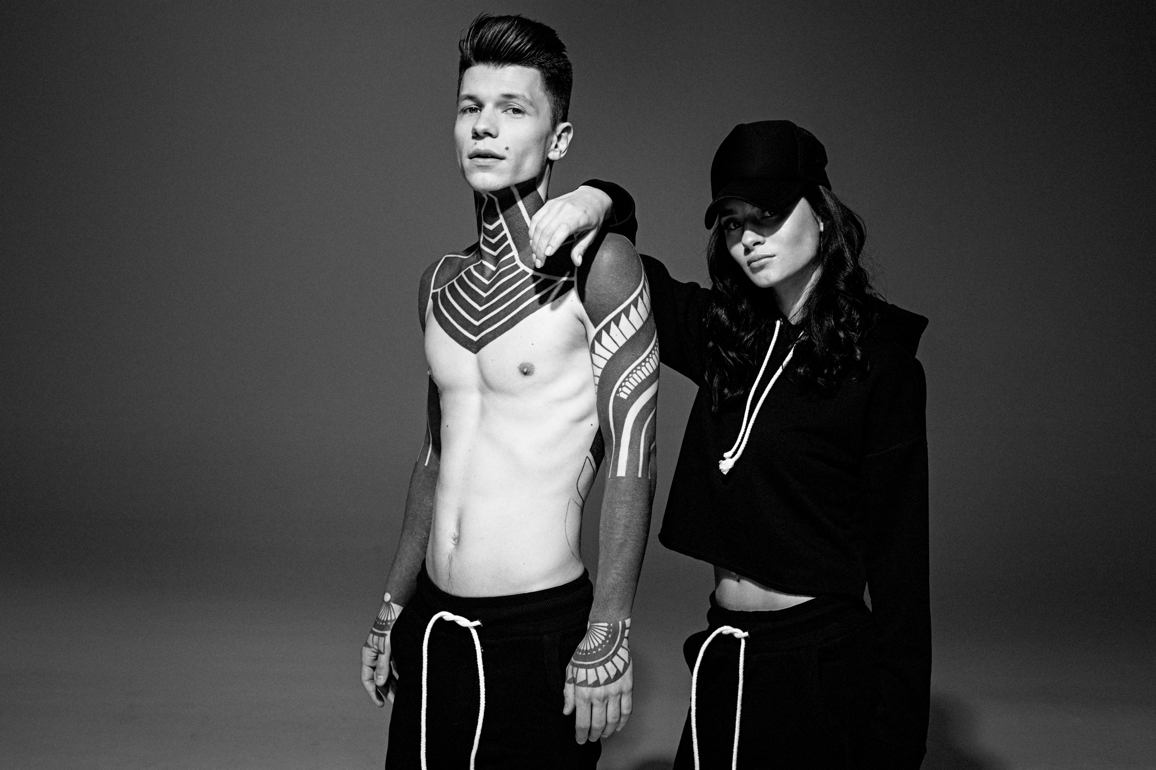black and white shot of young topless man with tattoos and woman in streetwear cap kiev, jake davies 4k, HD Wallpaper