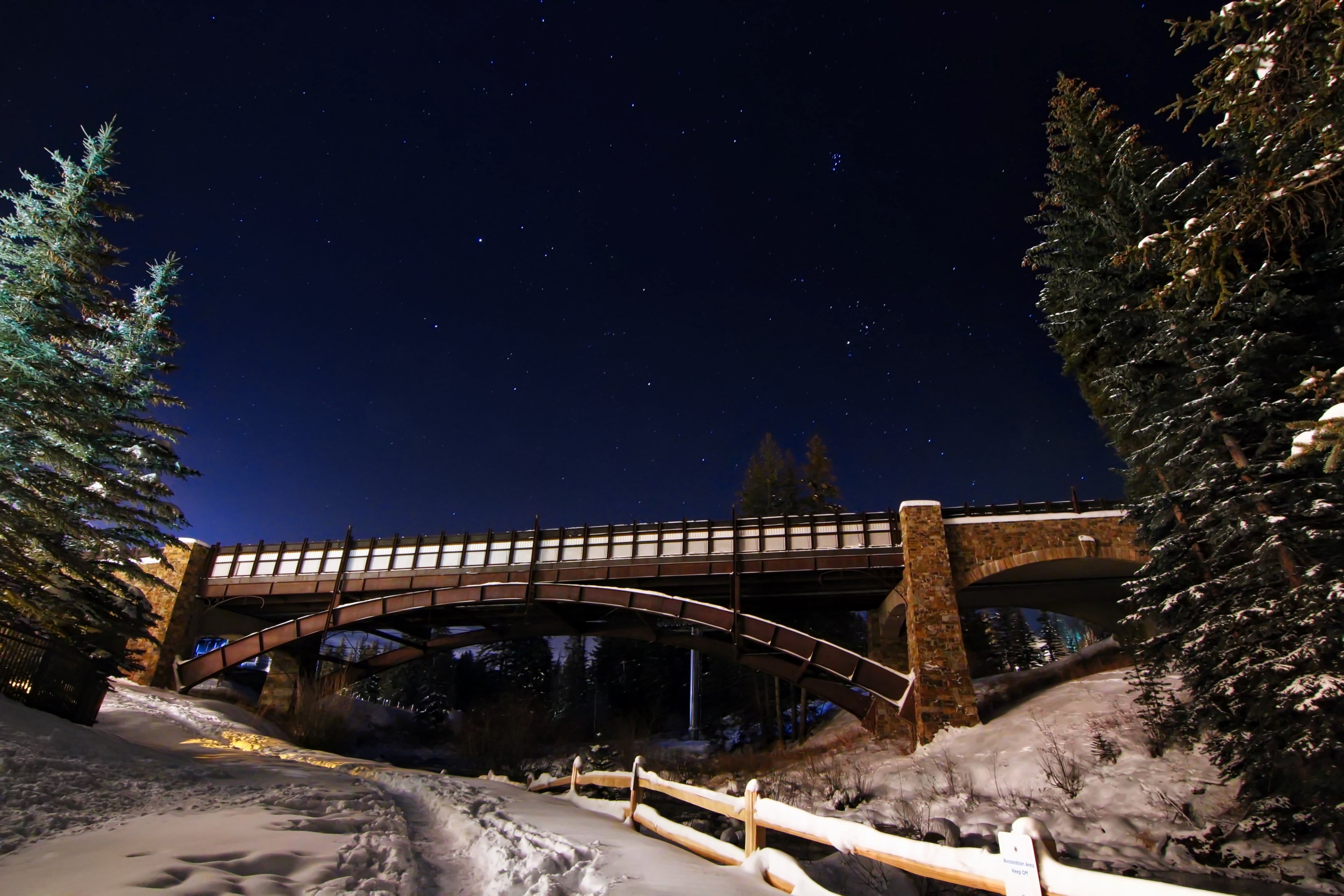 a bridge crossing over a fenced road at the vail ski resort in colorado, over a bridge 4k, HD Wallpaper