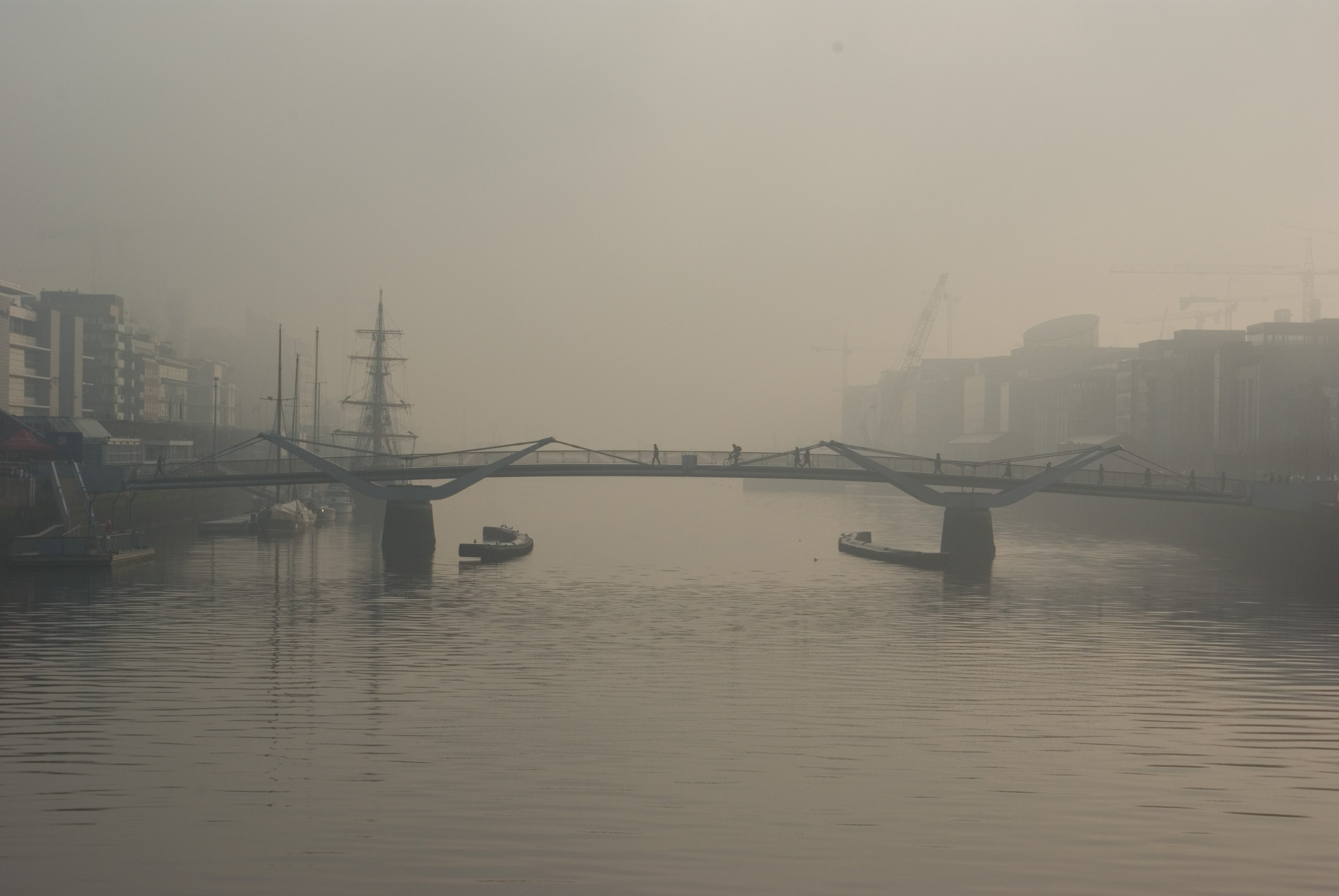 industrial city structures by a bridge over foggy water, foggy city silhouettes 4k, HD Wallpaper