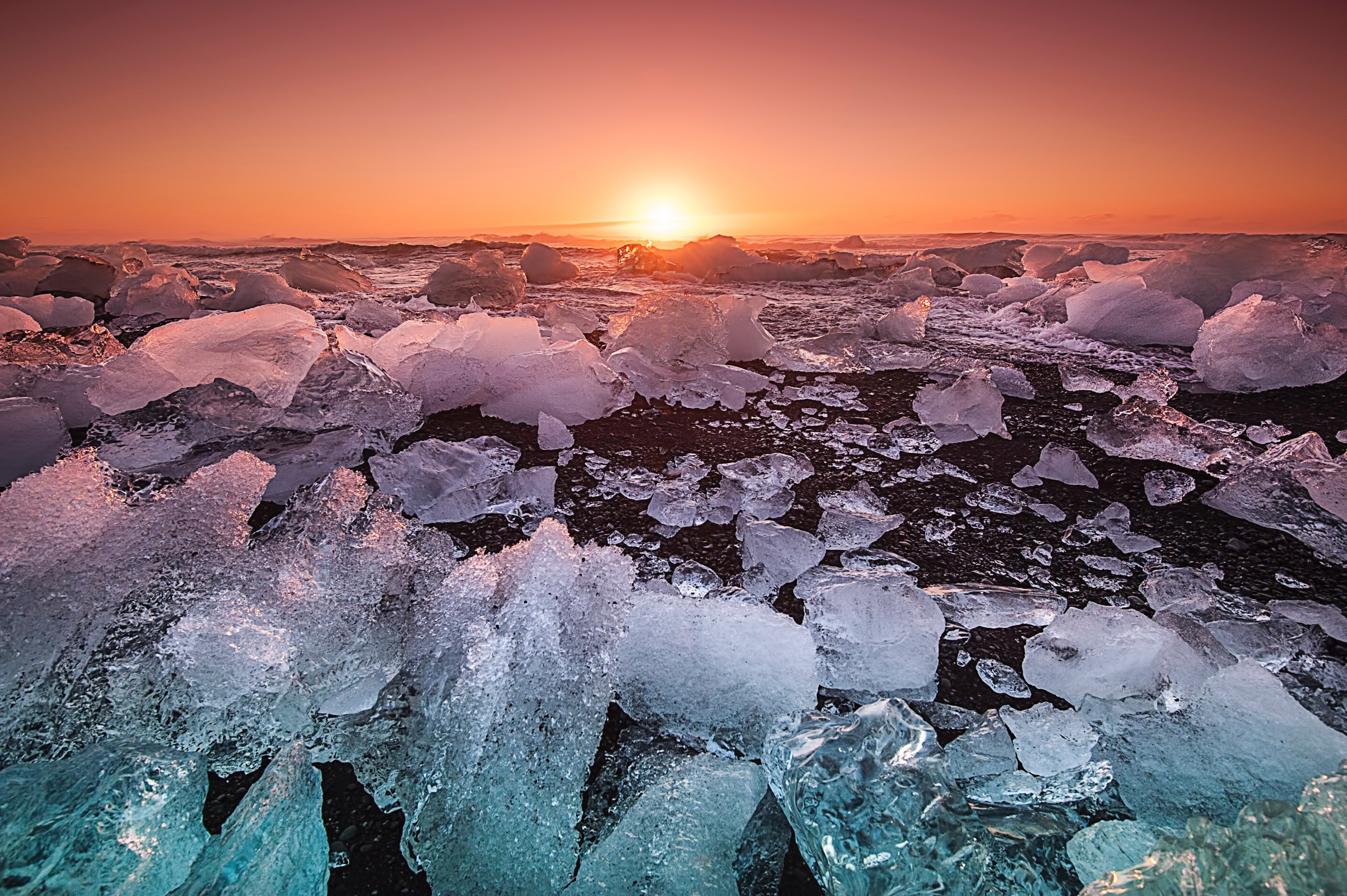 ice breaks up on the shoreline at sunset against an orange sky and calm water in iceland, iceland shoreline sunset_ 4k, HD Wallpaper