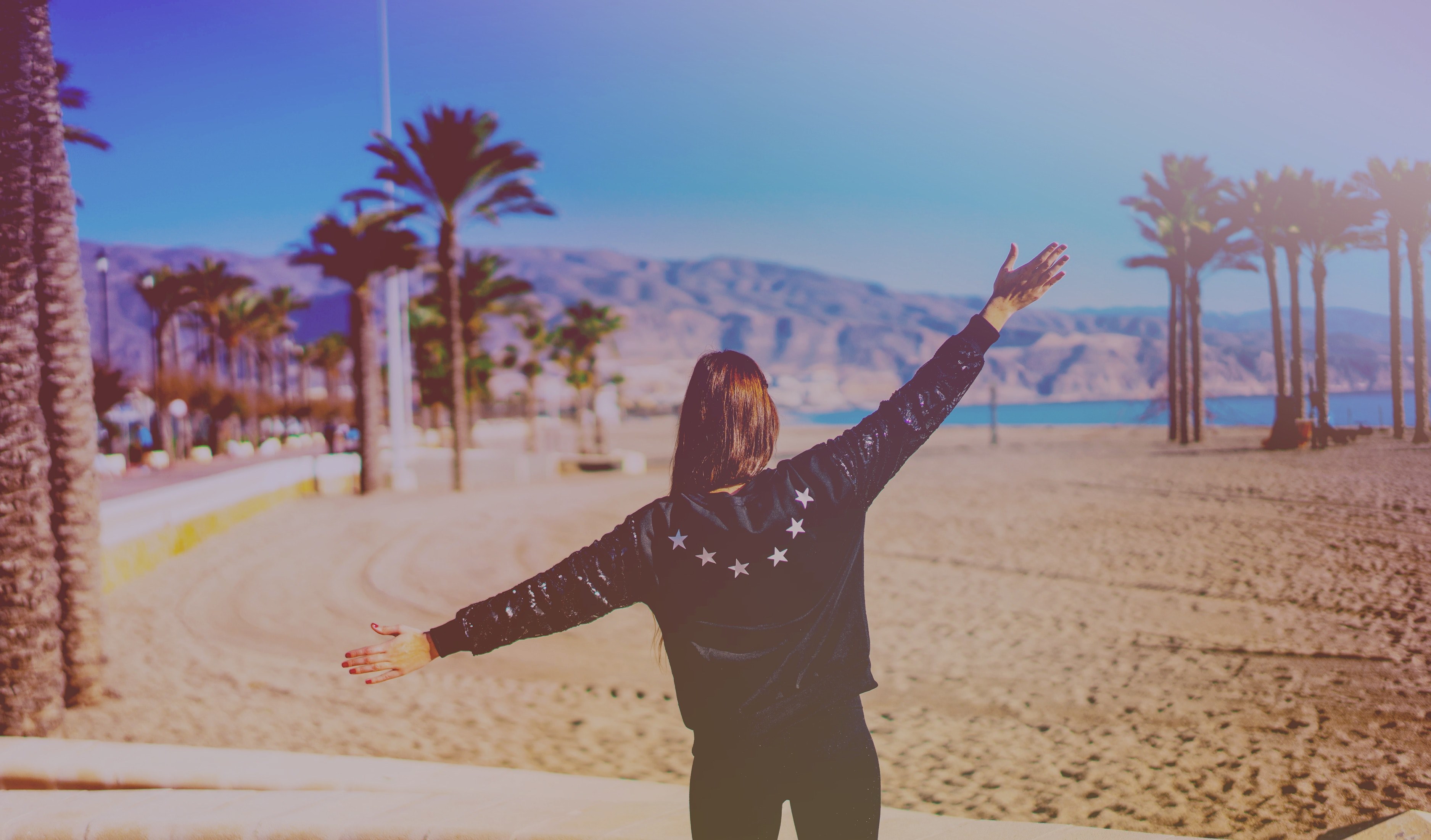 woman in a jacket spreads her arms on the beach at roquetas de mar, woman spreads her arms 4k, HD Wallpaper