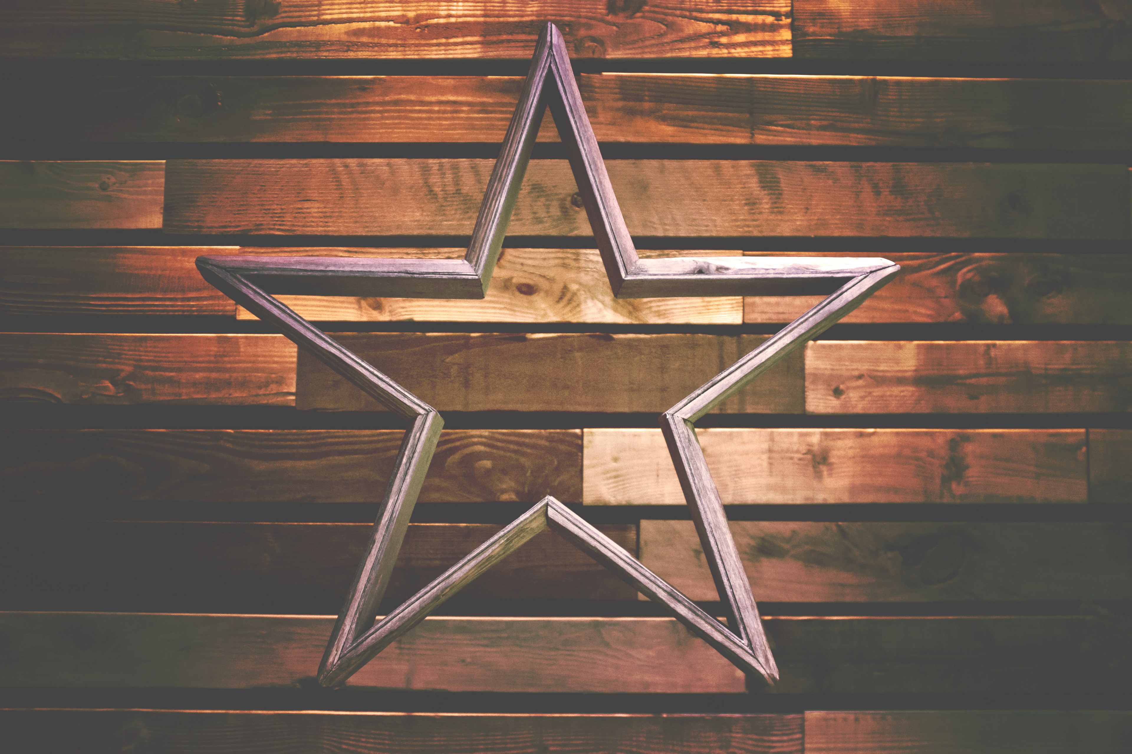 a wooden decoration in the shape of a hollow star against a wooden wall, wooden star 4k, HD Wallpaper