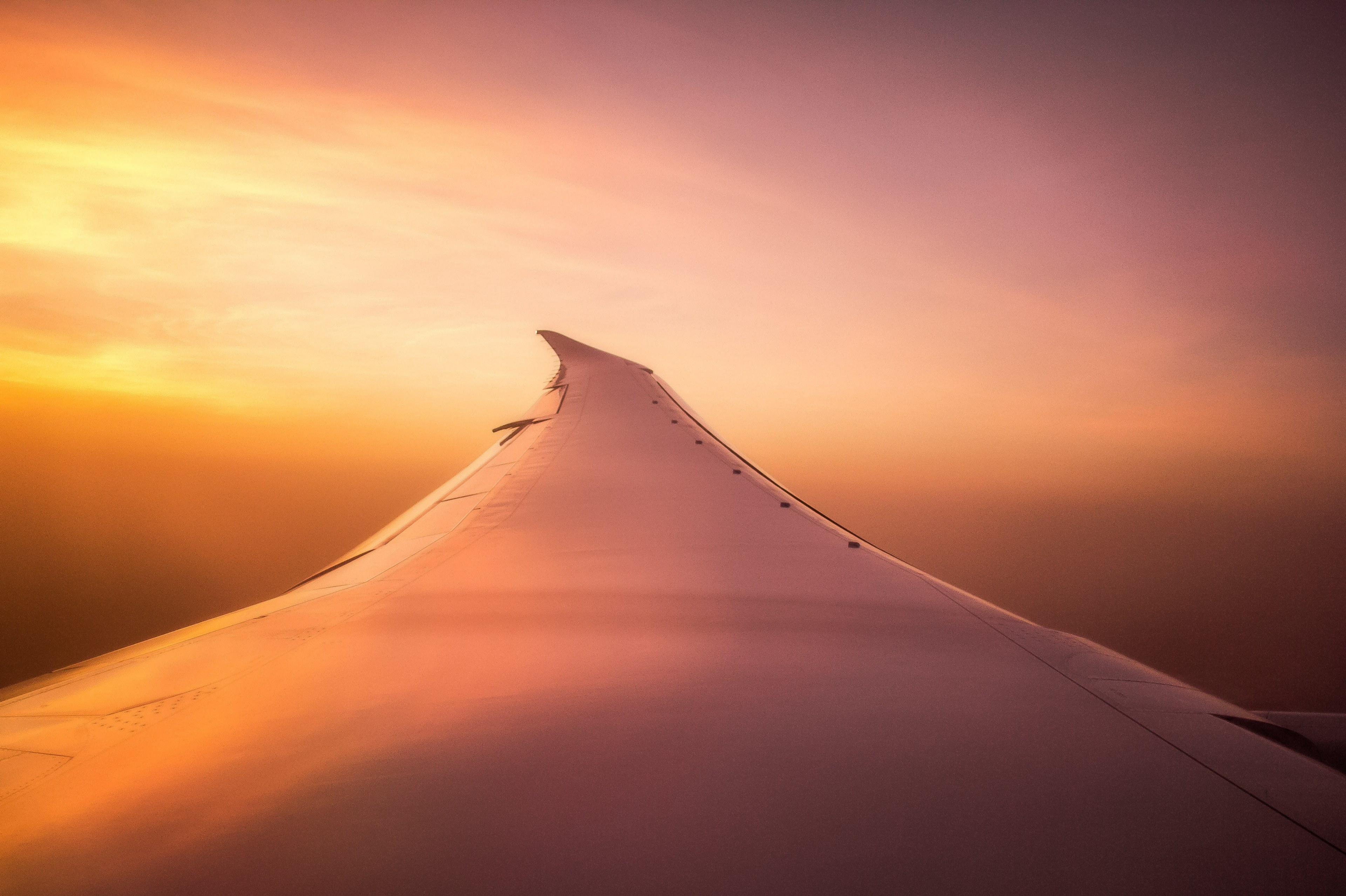 a long airplane wing seen from the window during sunset, sunset from a plane 4k, HD Wallpaper