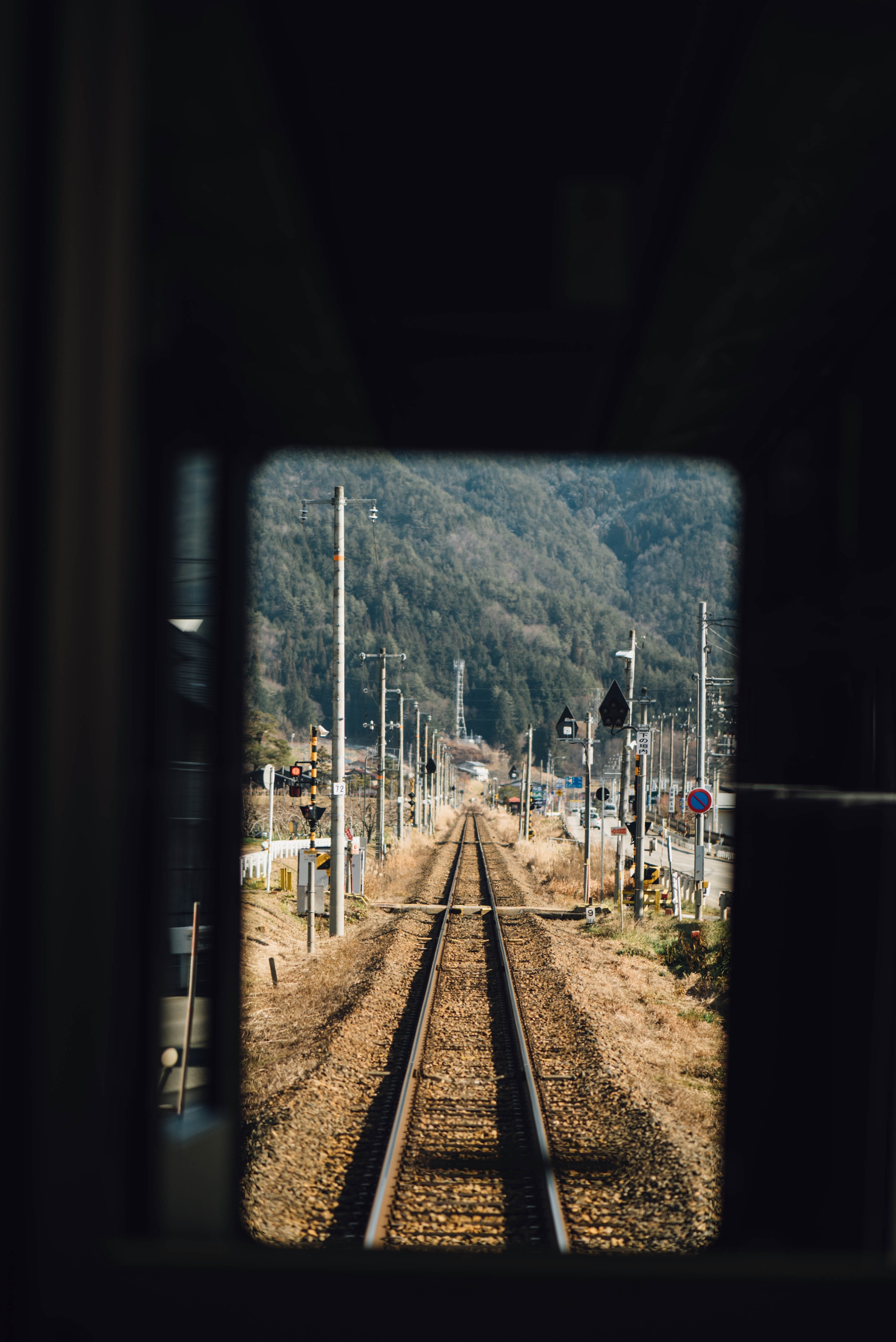looking through a tunnel at a countryside railroad track, train track 4k, Phone HD Wallpaper