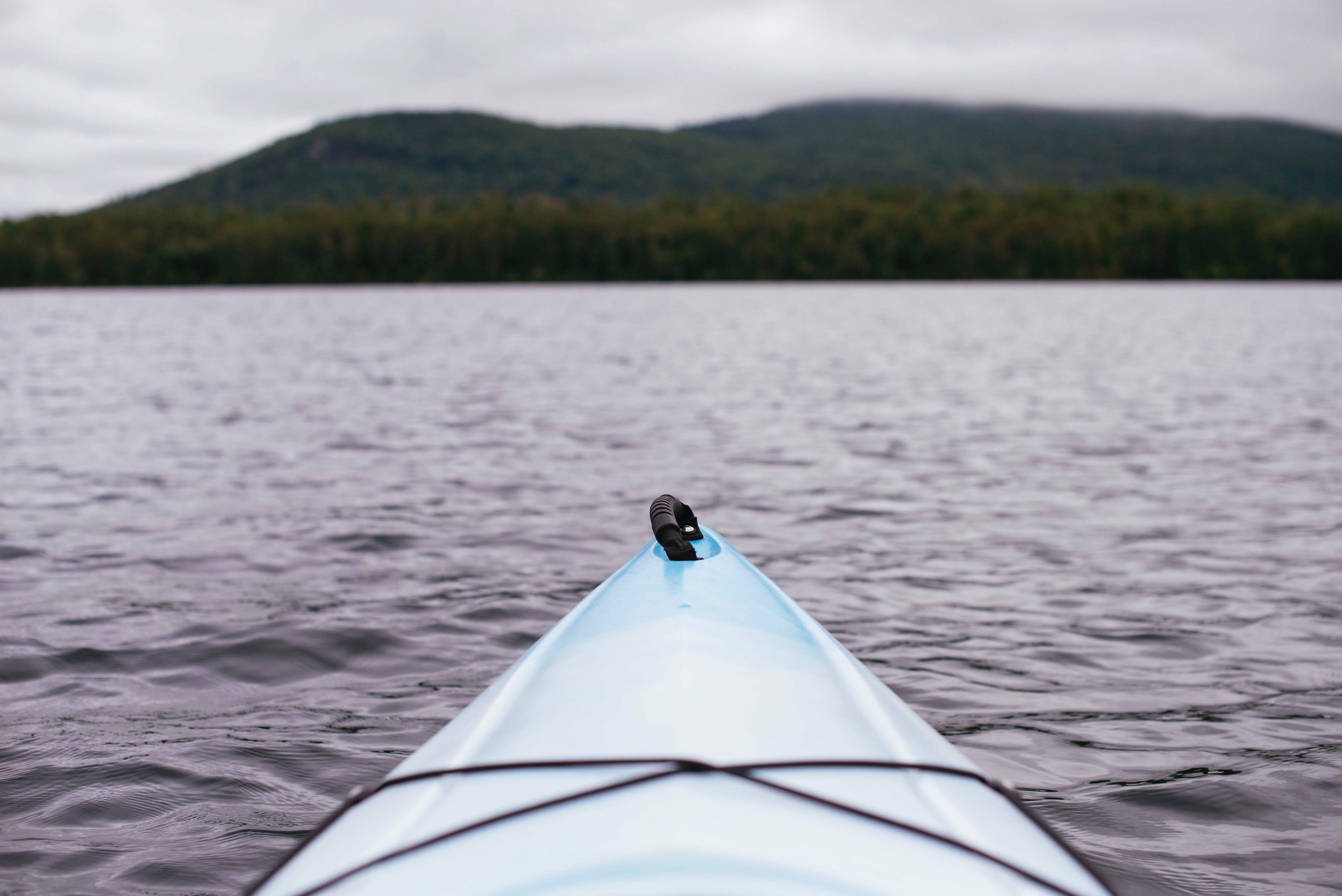 view from a kayak on its bow and a choppy lake, in a kayak on a lake 4k, HD Wallpaper