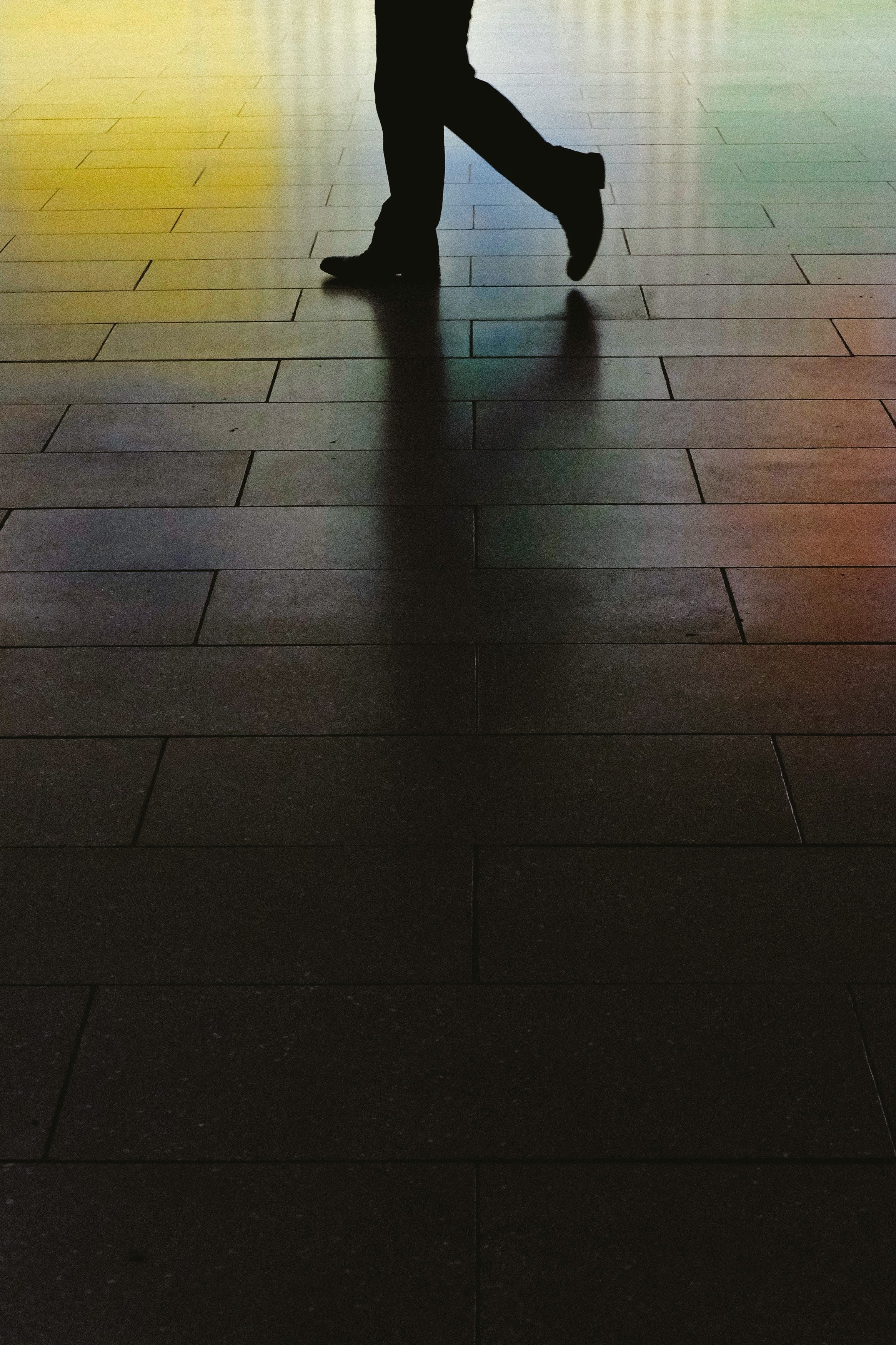 a low shot of a persons legs on a glossy sidewalk, feet on a colorful sidewalk 4k, Phone HD Wallpaper