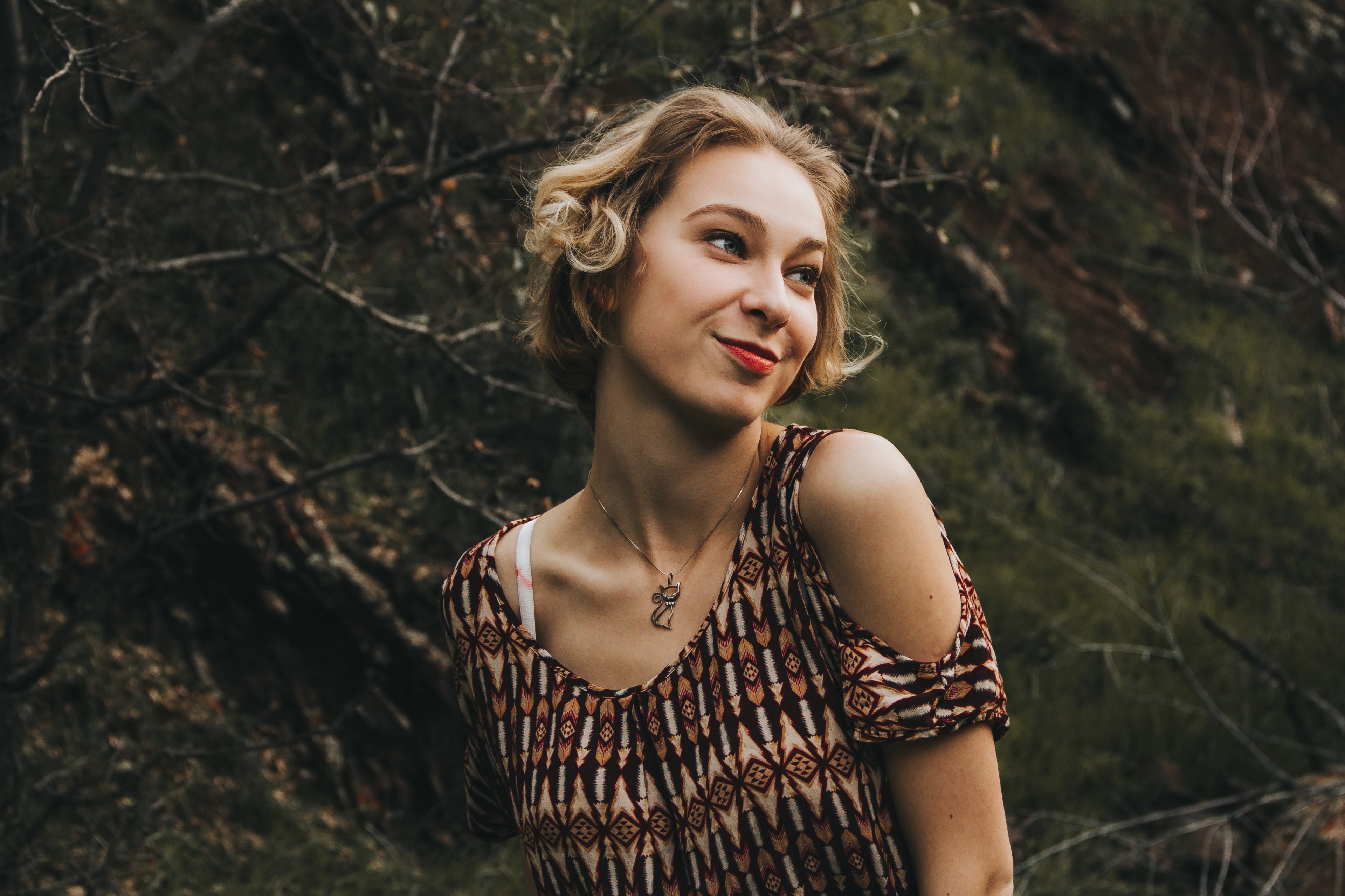 happy woman poses playfully near a forest hillside, happily alone 4k, HD Wallpaper