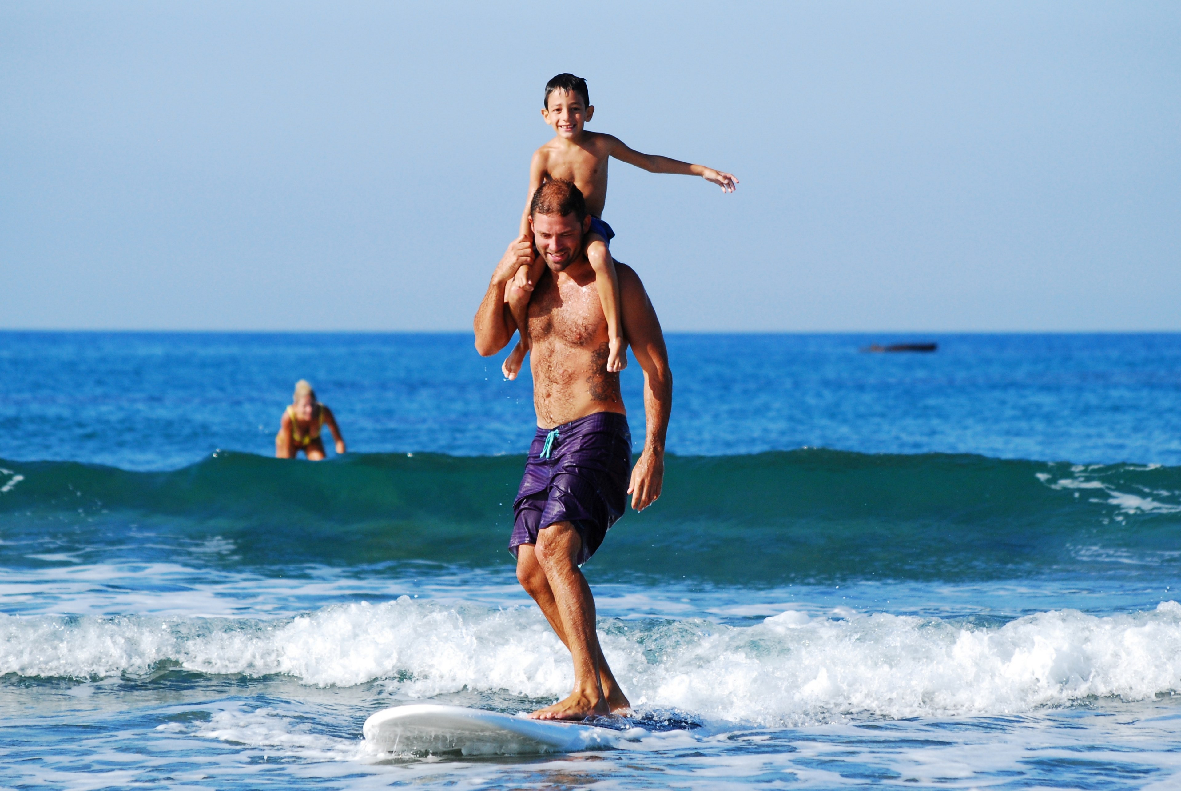 a man and his son surfing on a surfboard in the sea in cyprus, cyprus father and son 4k, HD Wallpaper