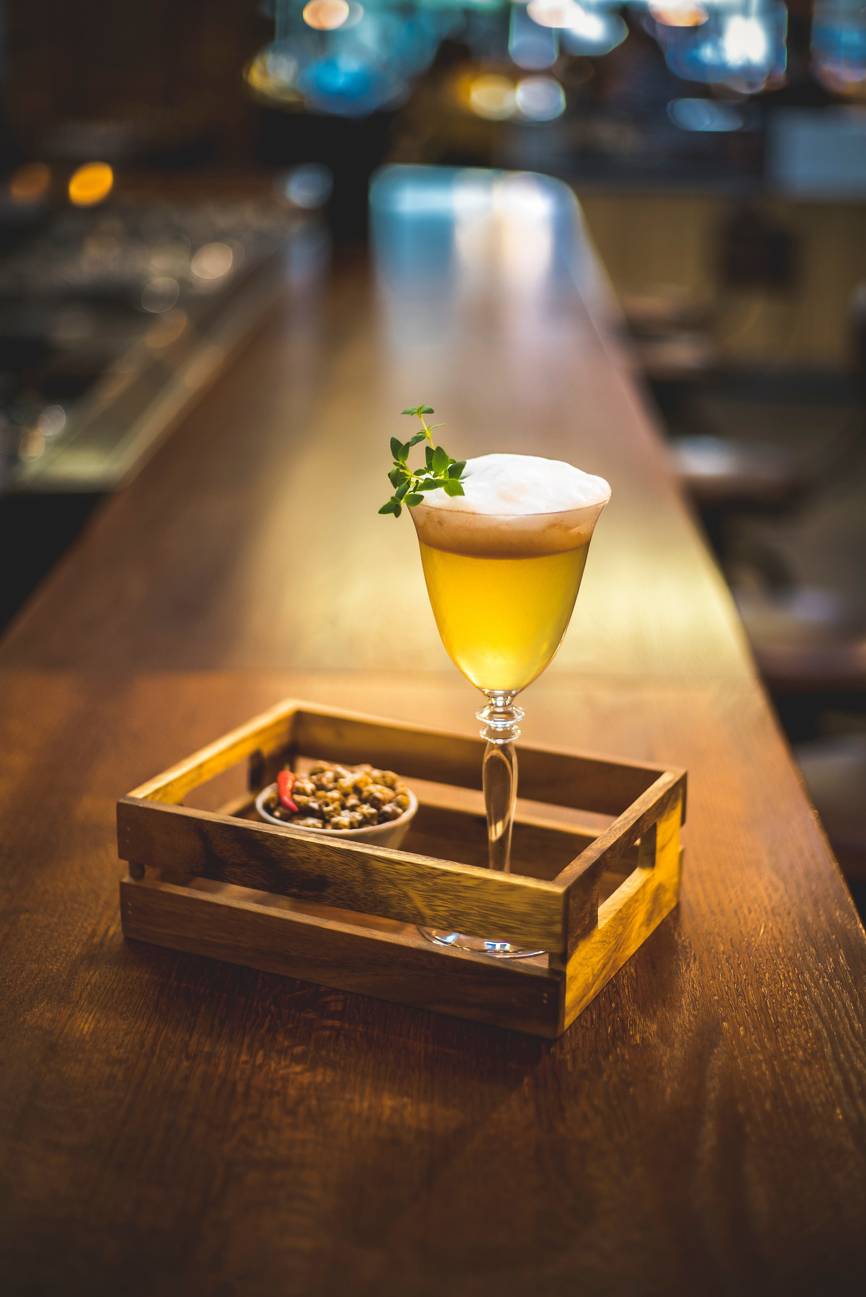 a cocktail beverage inside a crate on a table in a bar in warsaw, beverage inside a crate 4k, Phone HD Wallpaper