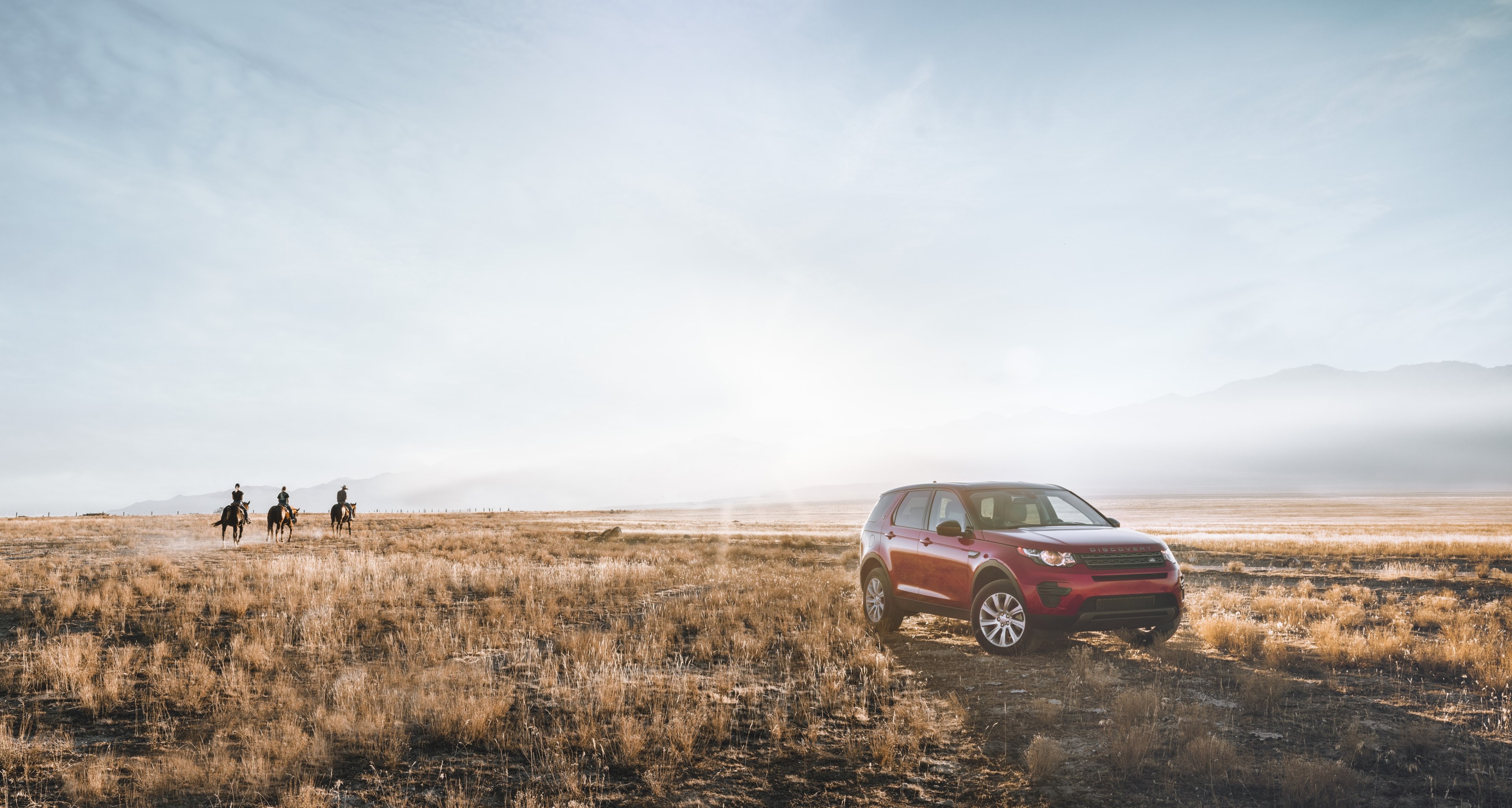 a bright shot of an off road vehicle parked on a prairie with three horse riders in the distance, suv and cowboys on a sunny afternoon 4k, HD Wallpaper