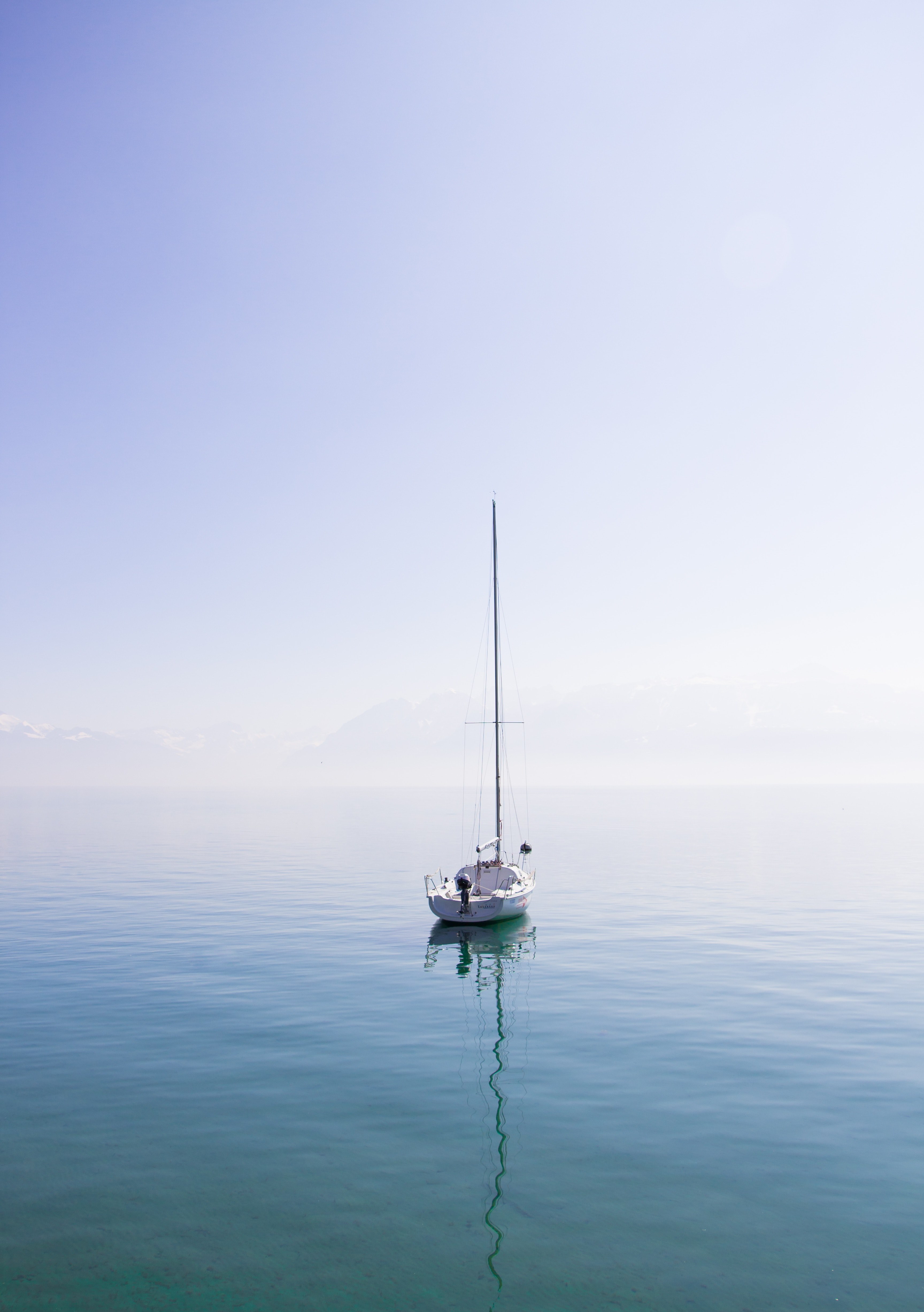 lone sailboat sitting on a calm blue lake on a sunny day in lausanne, serene sailboating 4k, Phone HD Wallpaper