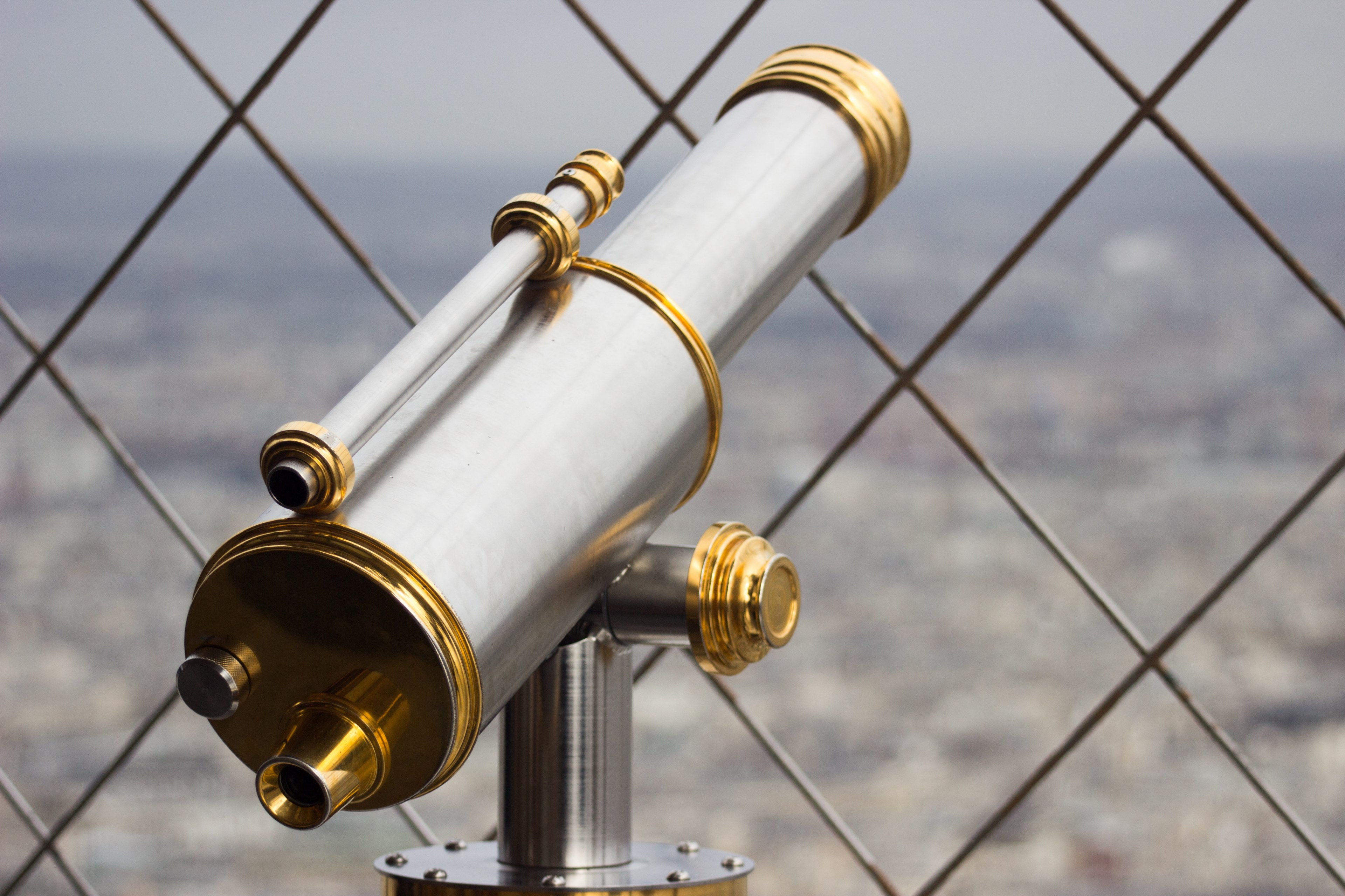 sleek telescope peers through a chainlink fence over the city, rooftop views 4k, HD Wallpaper