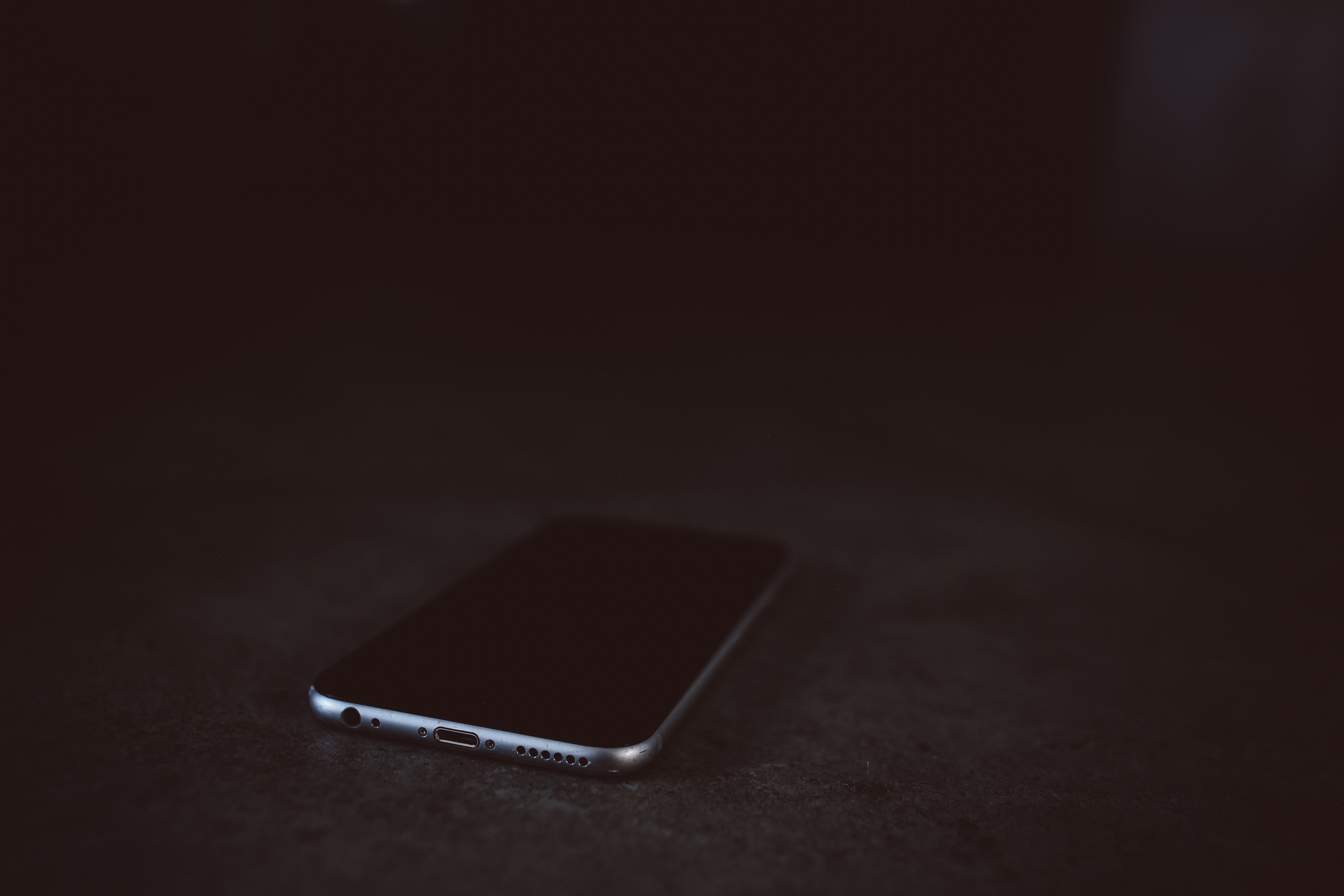 an iphone cellphone on a black surface, iphone cellphone 4k, HD Wallpaper
