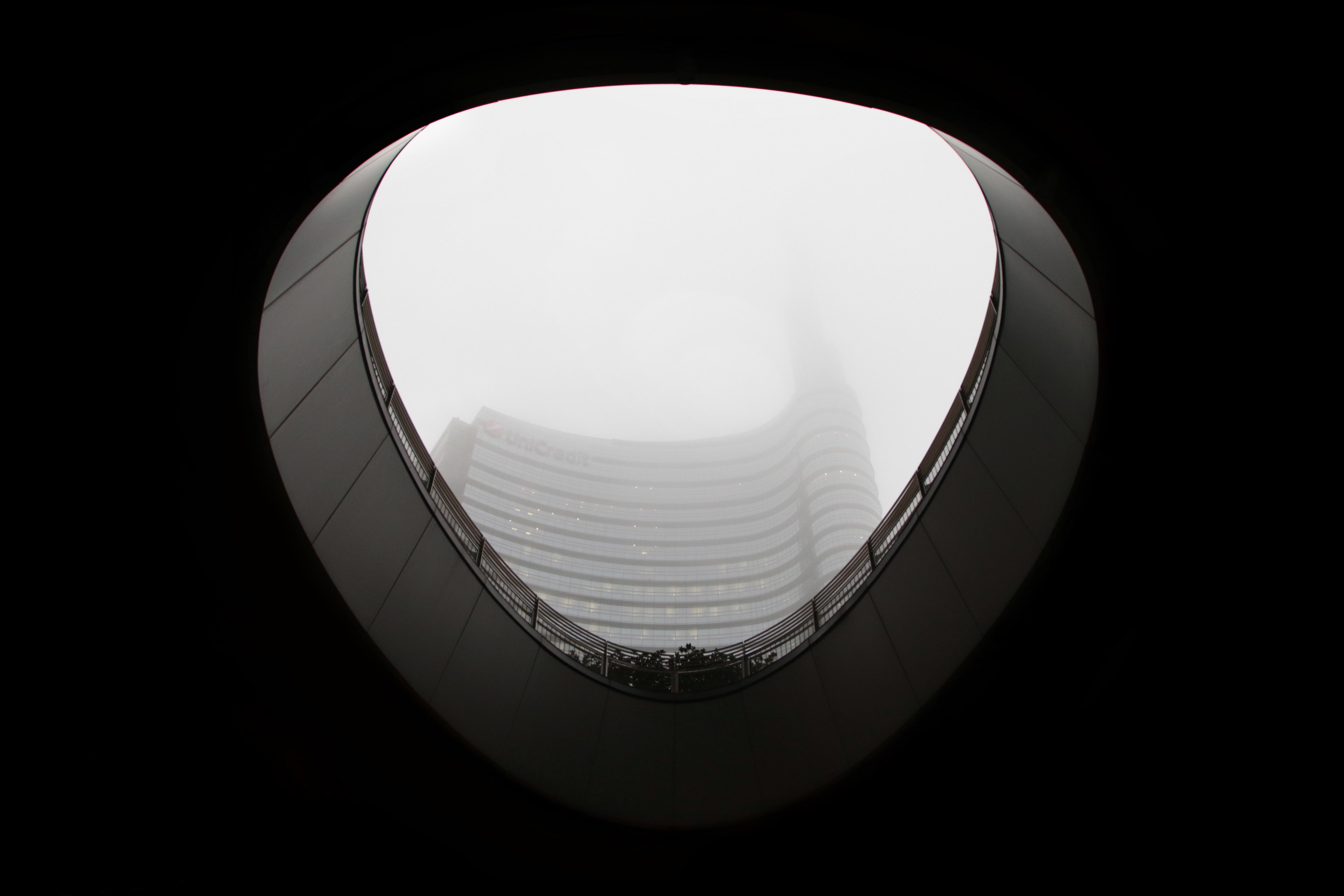 black and white shot from inside of building looking up at sky in milan, monochrome building roof hole 4k, HD Wallpaper