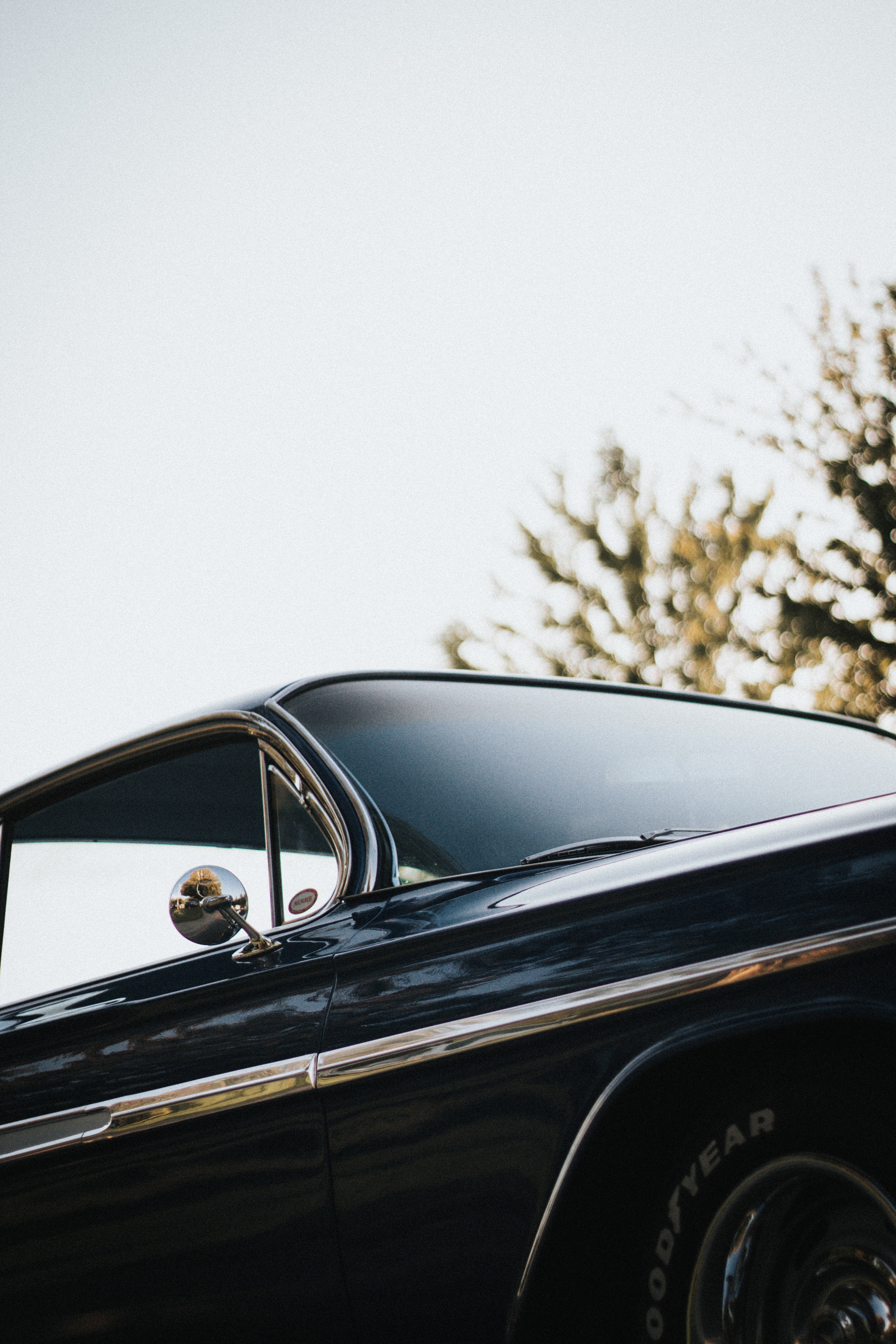 a low angle shot of a black vintage car, black vintage car 4k, Phone HD Wallpaper