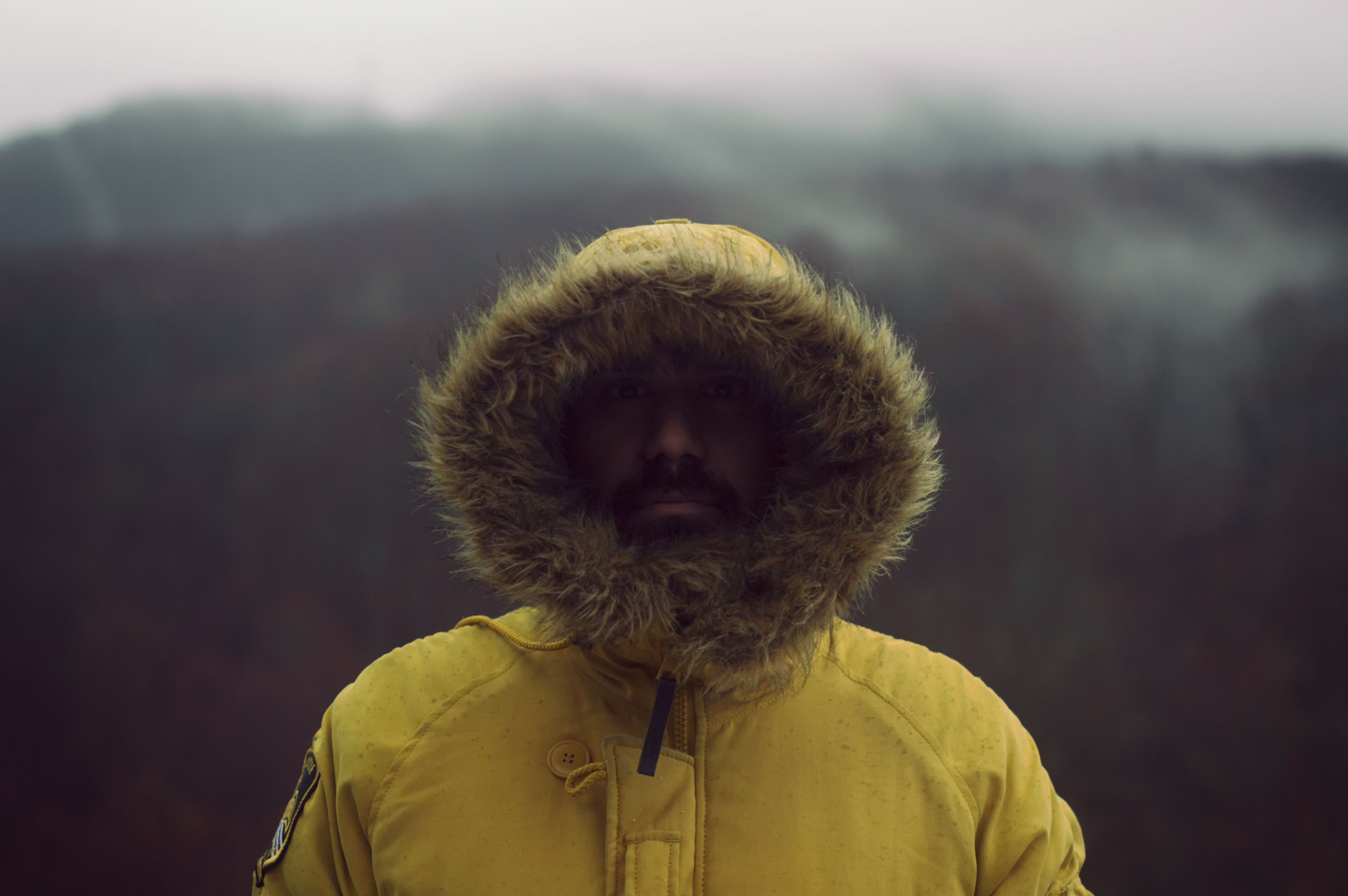 portrait of a man in furry hooded coat on a cold wooded walk, bundled up 4k, HD Wallpaper