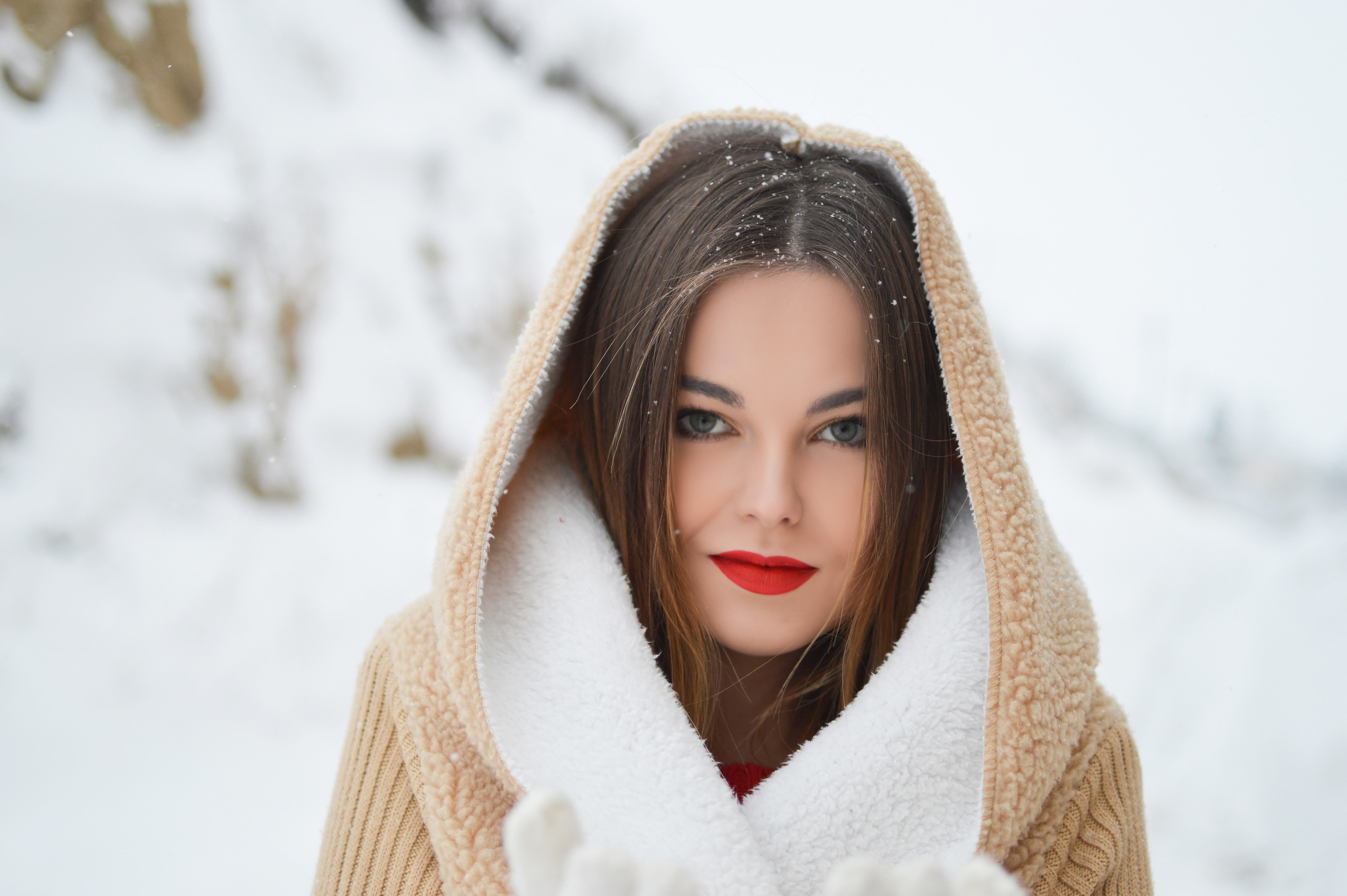a woman in bright red lipstick and a hooded coat smiles in snow in florina, hooded woman in snow 4k, HD Wallpaper