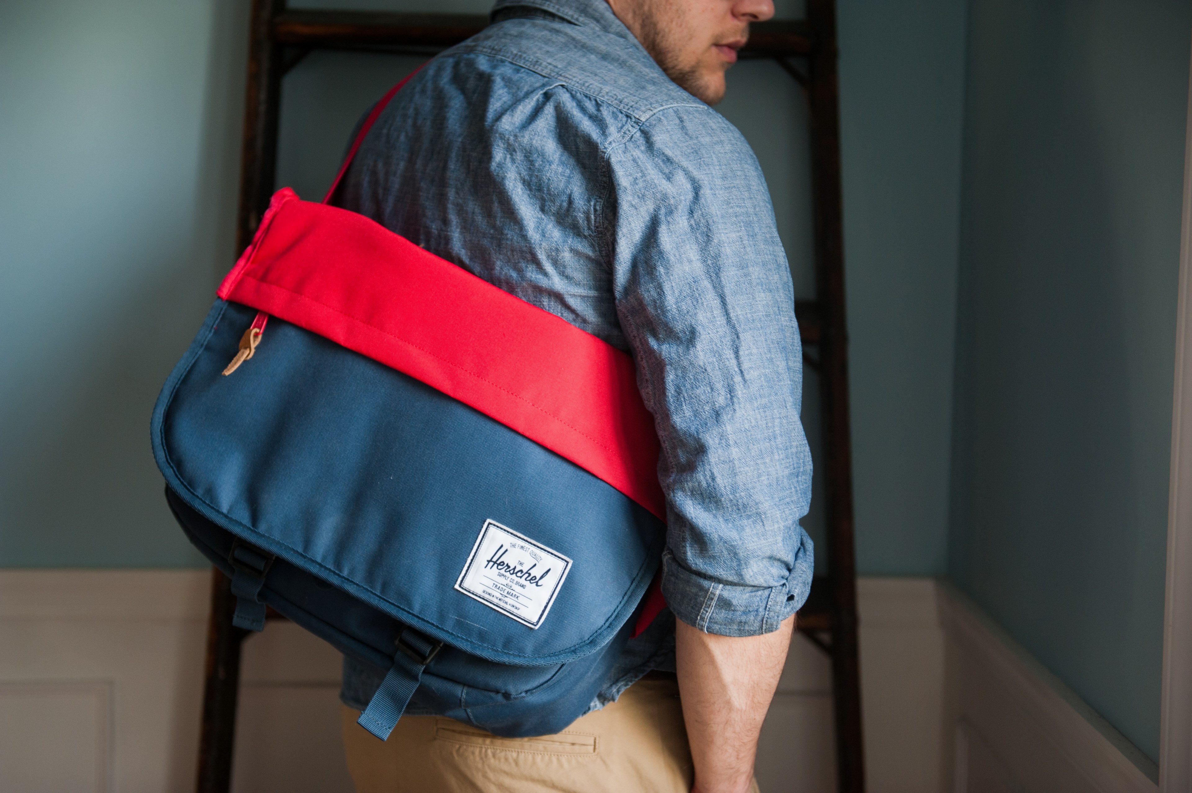 a man in a denim jacket with a bag on his arm, man with a red and blue bag 4k, HD Wallpaper