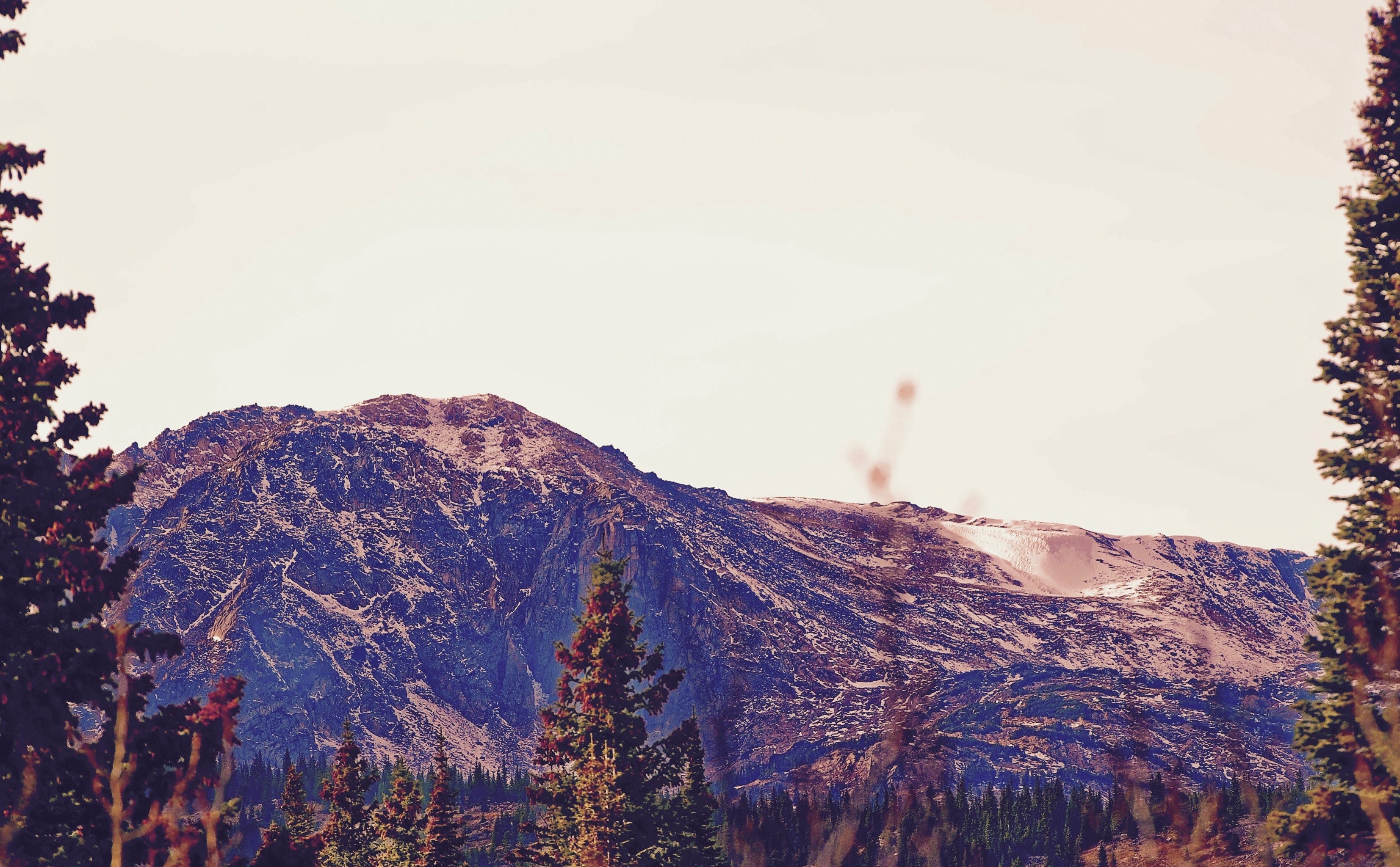a picturesque mountain scenery under a pale sky, violet mountain 4k, HD Wallpaper