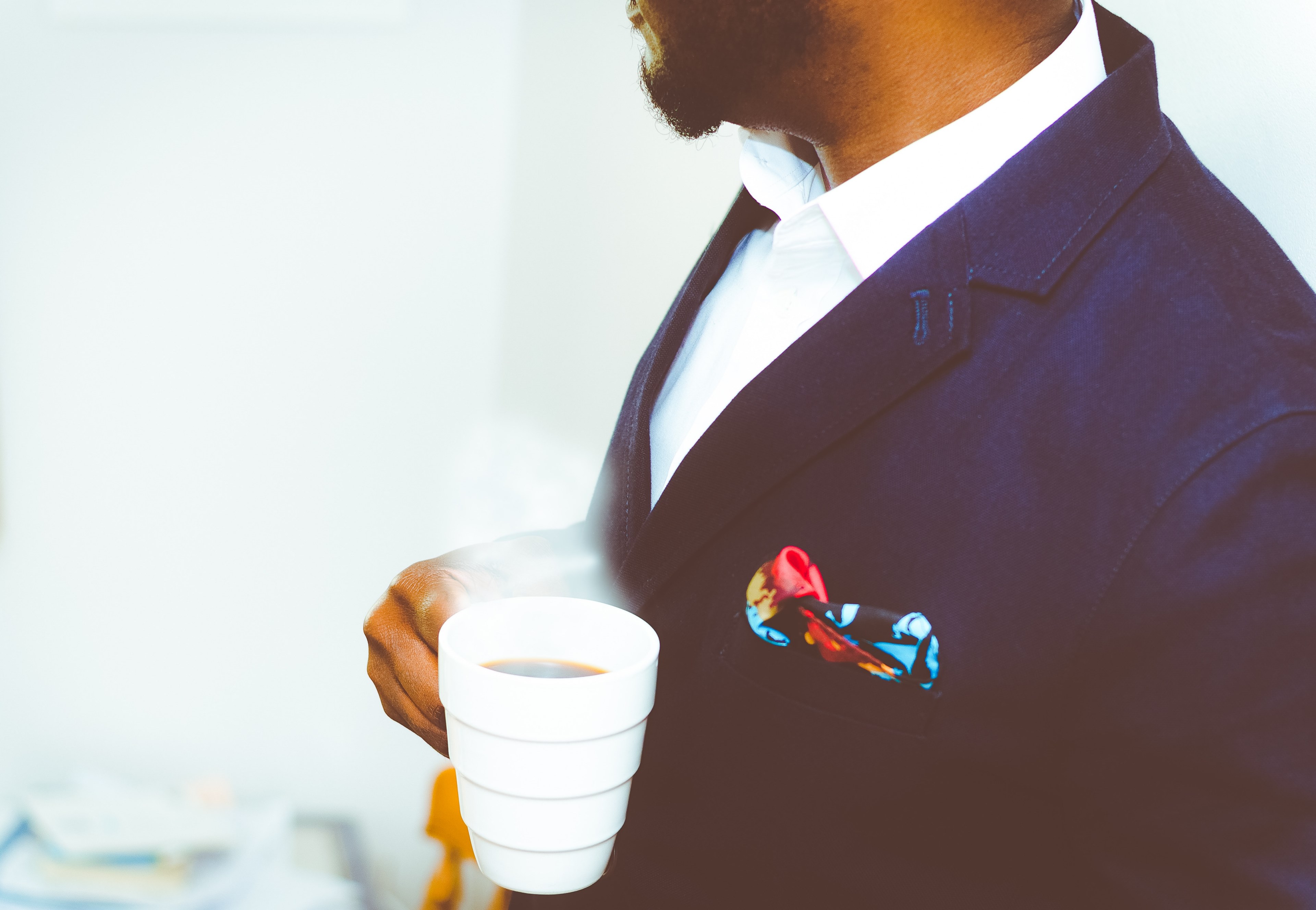a man in a navy blue jacket holding a cup of hot coffee, elegant man with hot coffee 4k, HD Wallpaper