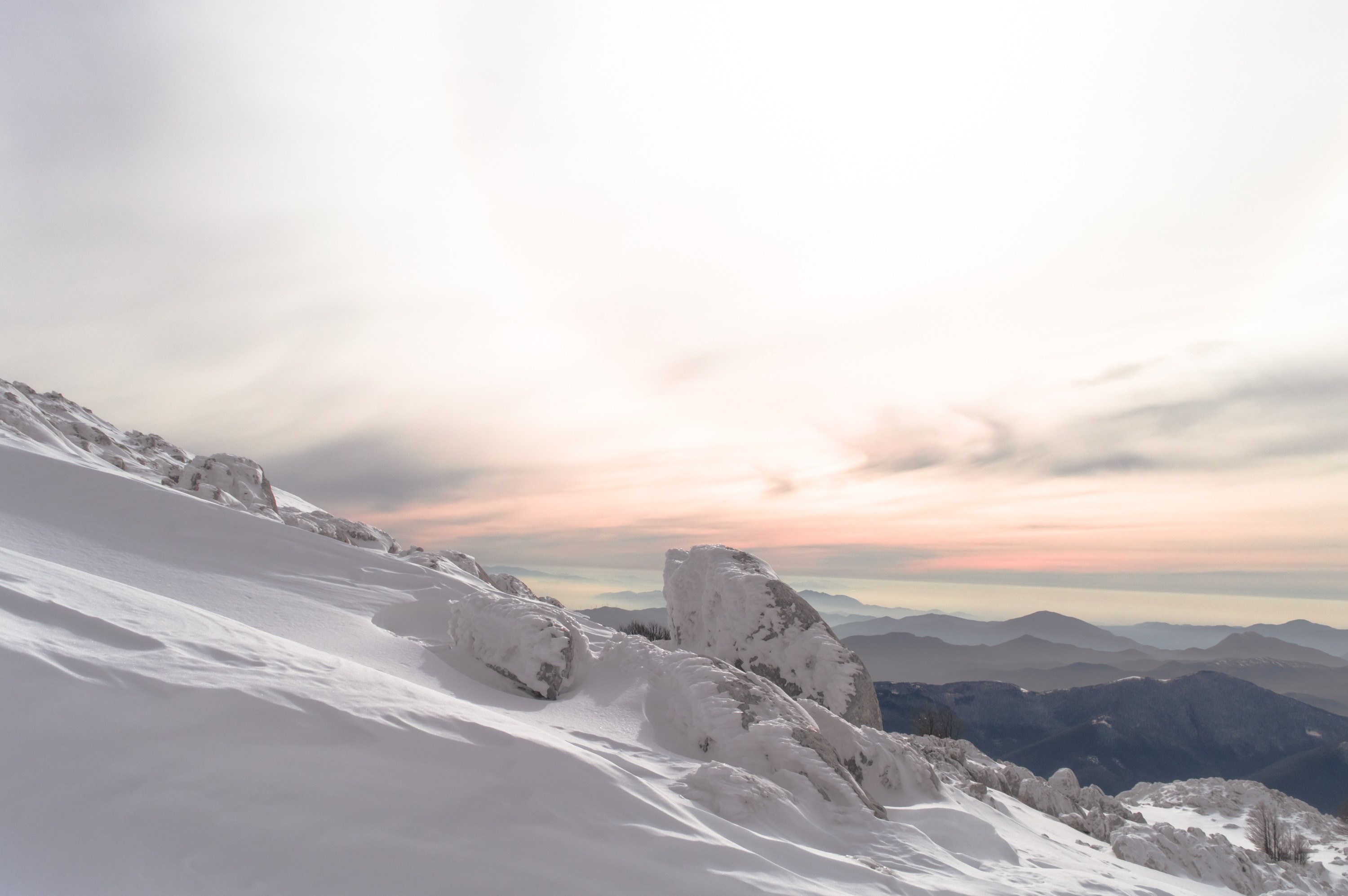 a sunset taken on top of a snow covered mountain, rocky winter mountain 4k, HD Wallpaper