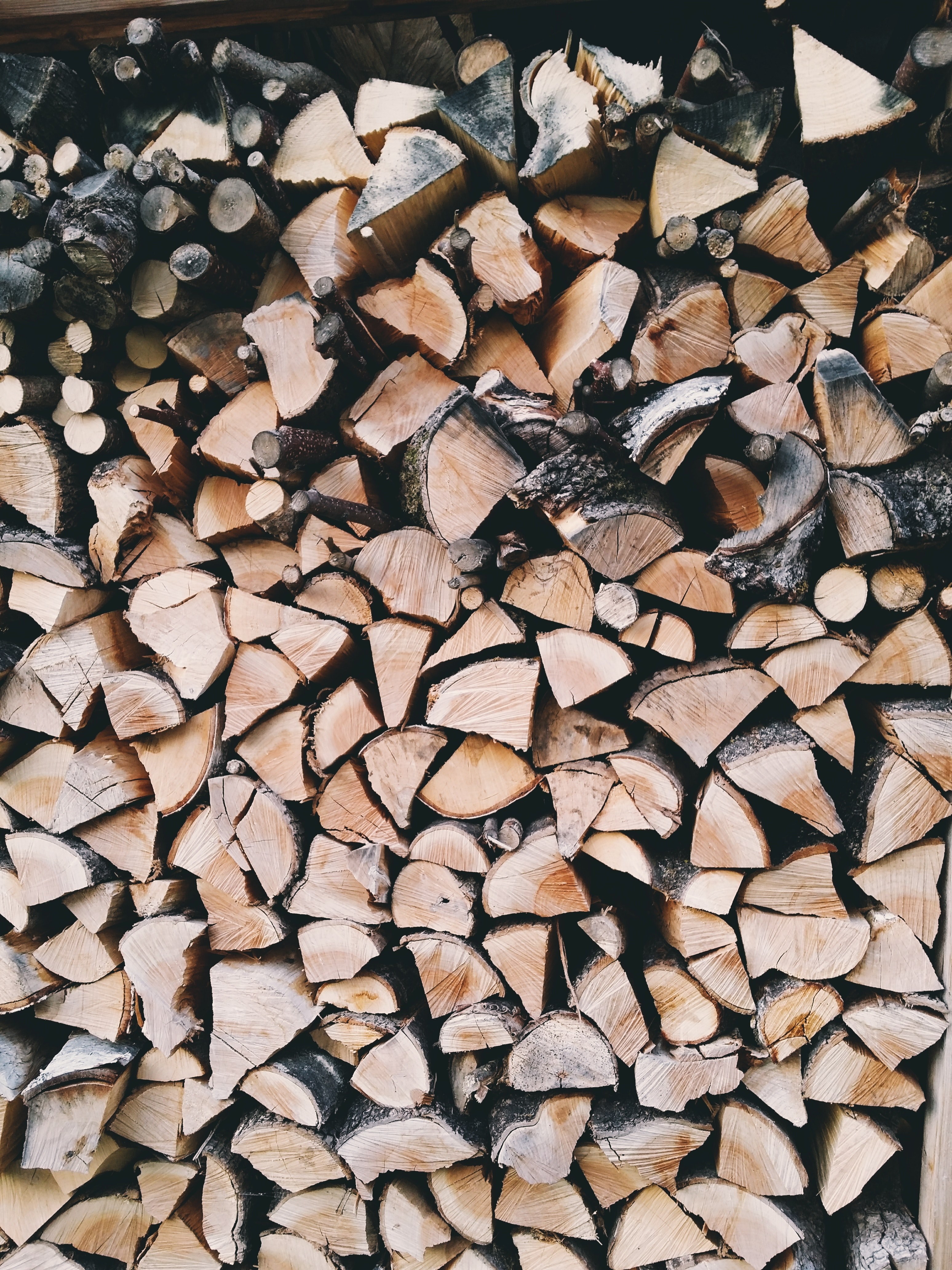 a high pile of wedge shaped firewood in munich, stacked firewood 4k, Phone HD Wallpaper