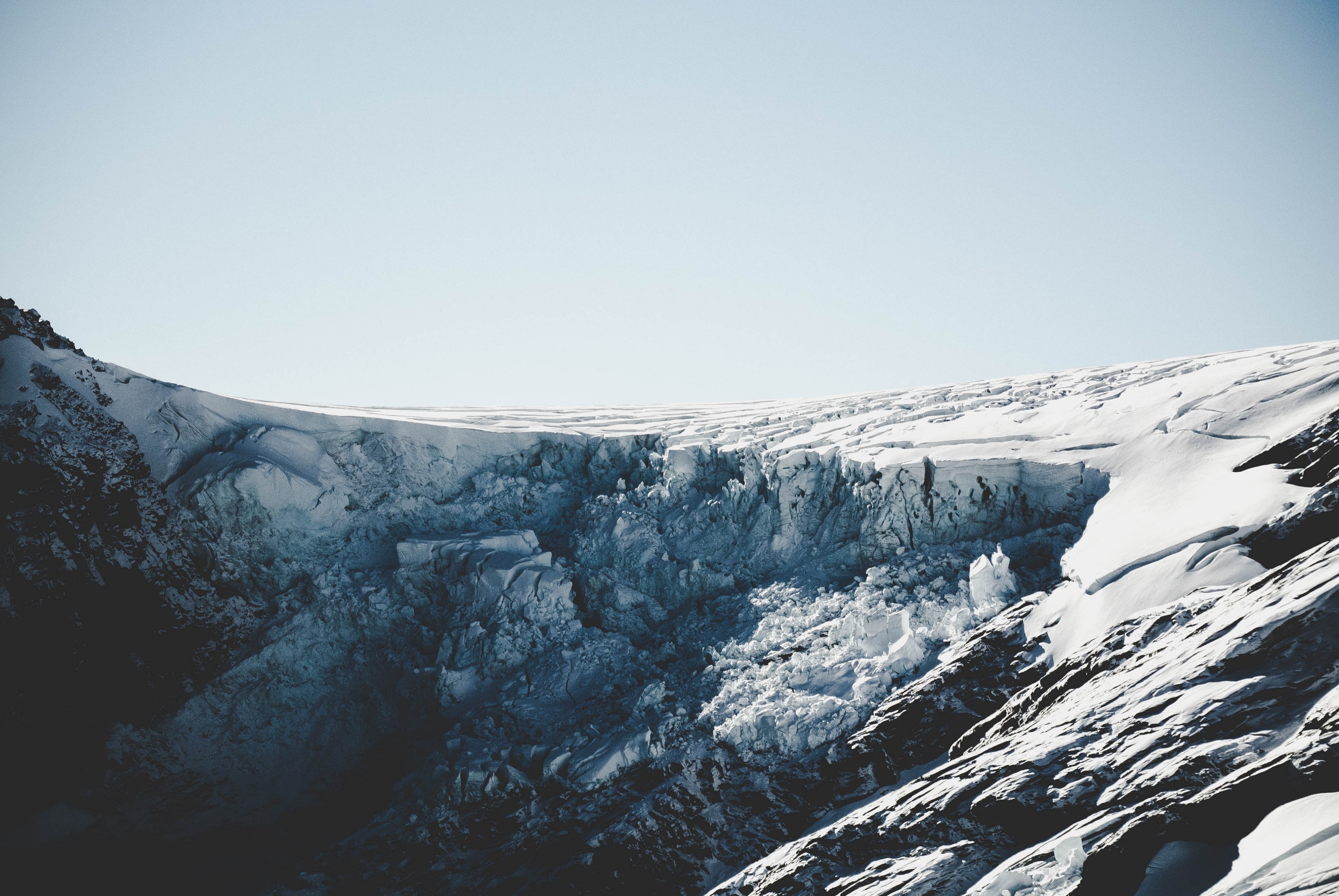 a glacier with snow meshes with the light blue sky in mount aspiring national park, the glacier 4k, HD Wallpaper