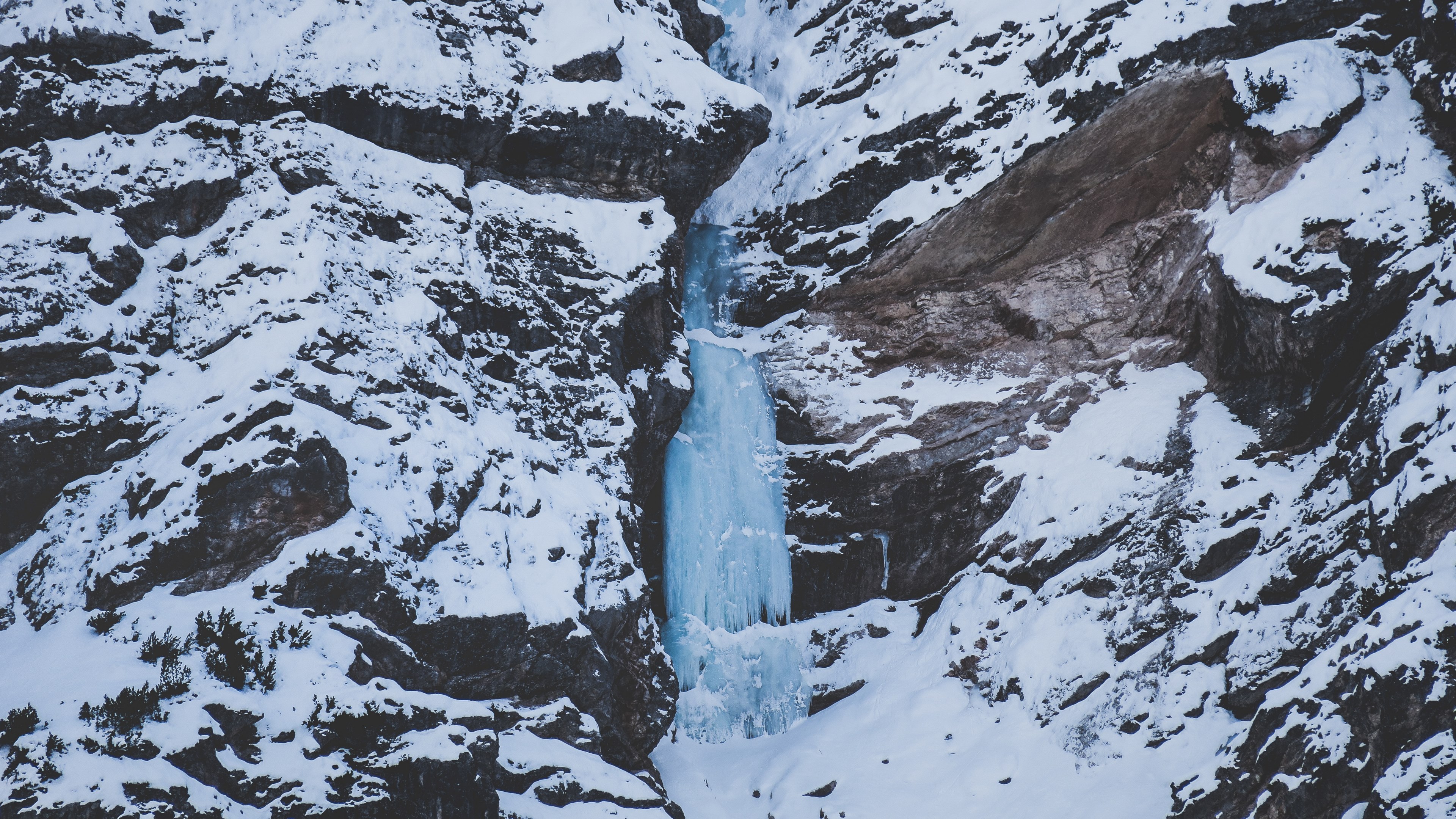 a frozen waterfall down a snow covered mountain in pragser wildsee in italy, day 23 unsplashdaily 4k, HD Wallpaper