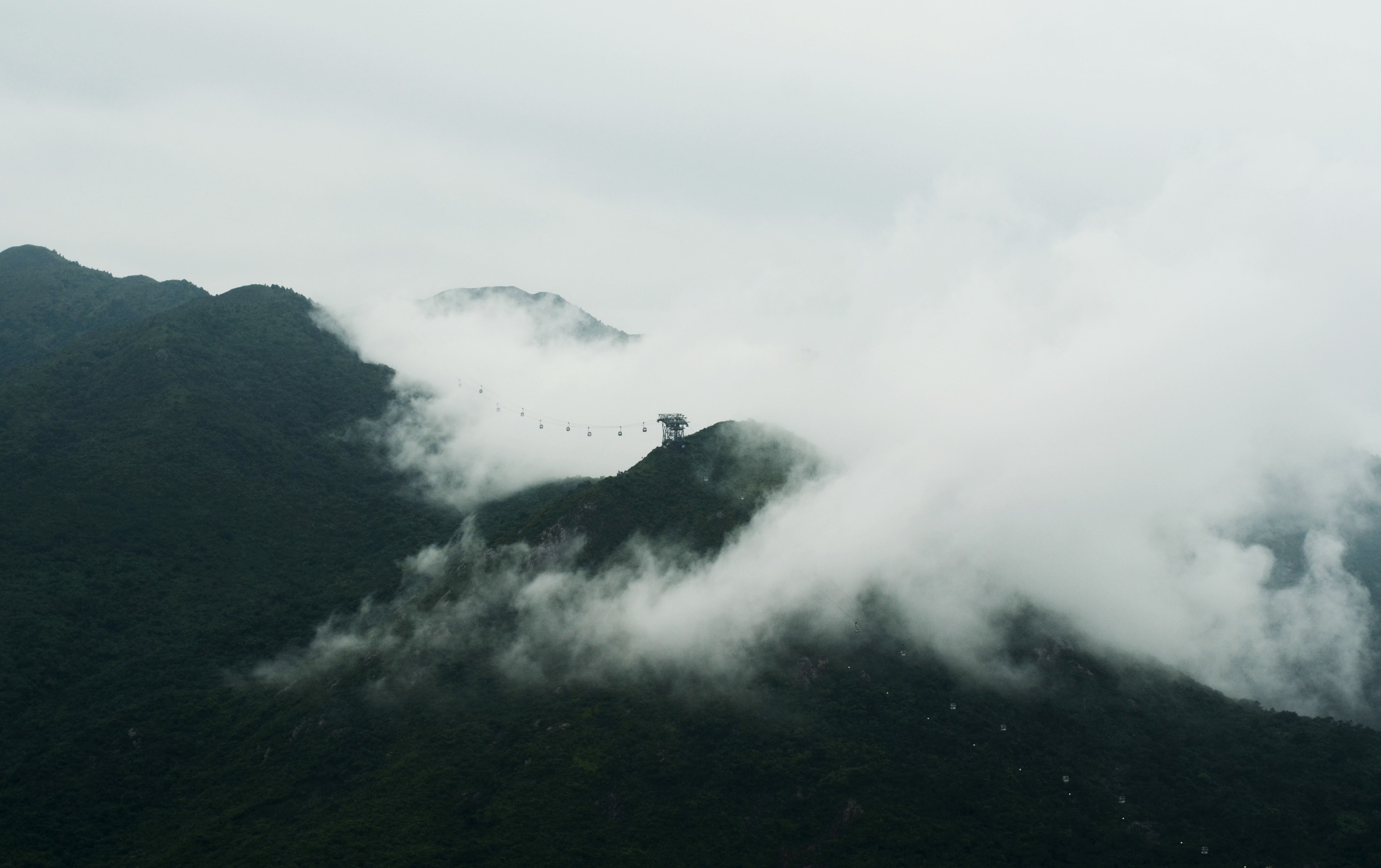 isolated cabin sits atop a mountain peak covered in rolling clouds, cable car 4k, HD Wallpaper