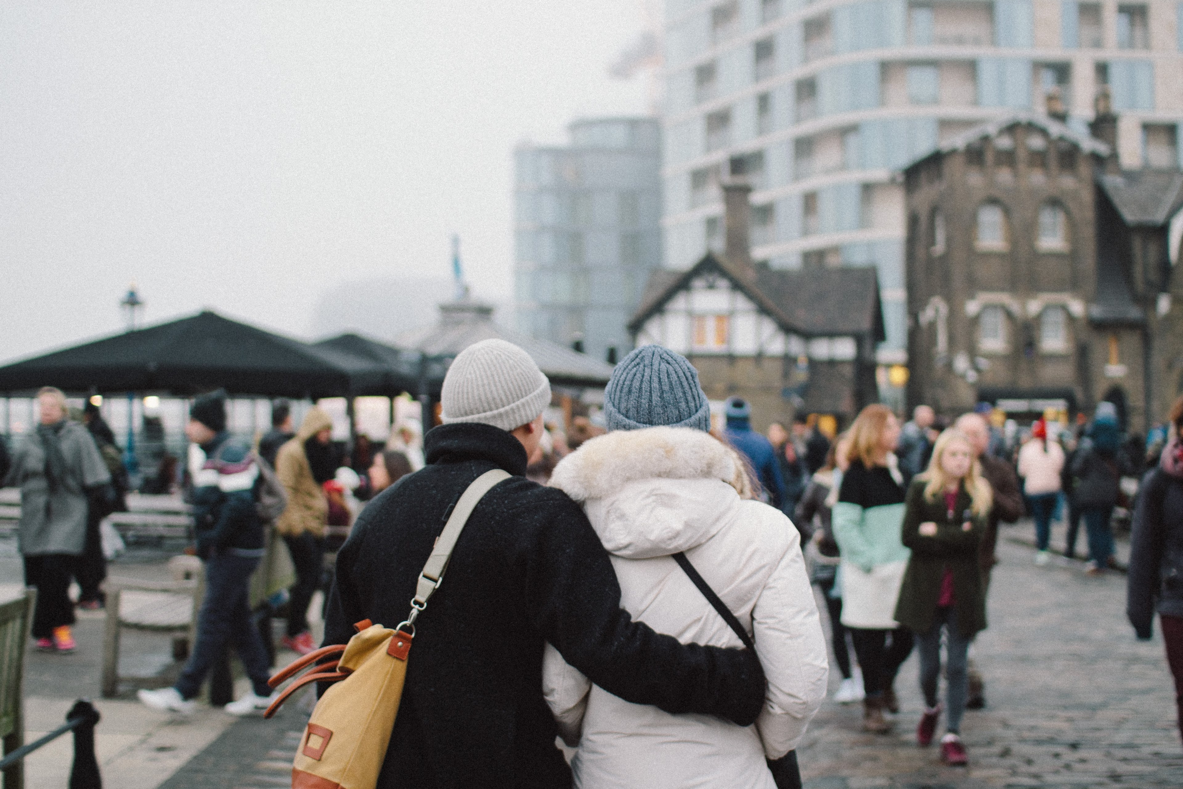 romantic couple traveling together walks in an embrace through a quaint town, touring the town 4k, HD Wallpaper